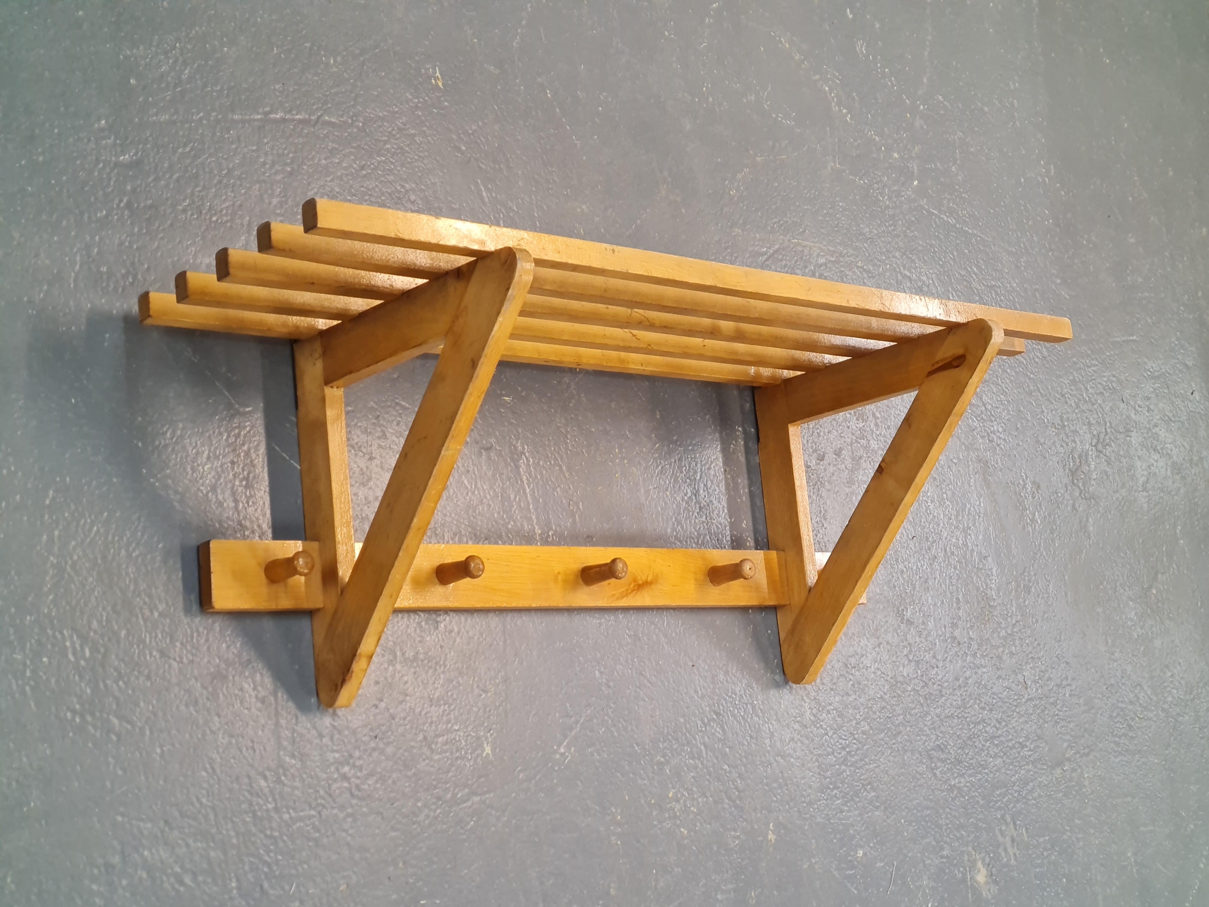 A simple but pragmatic coat rack designed by Ilmari Tapiovaara. Suitable for any home interior and is sure to add character into your entrance. A small but very sensible piece of finnish design history. The item has a manufacturers stamp by 