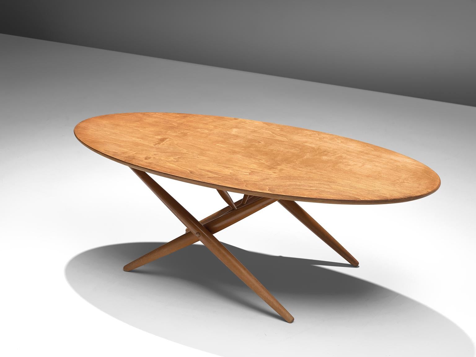 Ilmari Tapiovaara, coffee table, beech, Finland, 1960s.

Oval cocktail table in beech, designed by Ilmari Tapiovaara. The base consists of several X-shapes or crossed lines. Great graphical expression is created with these lines. The base is