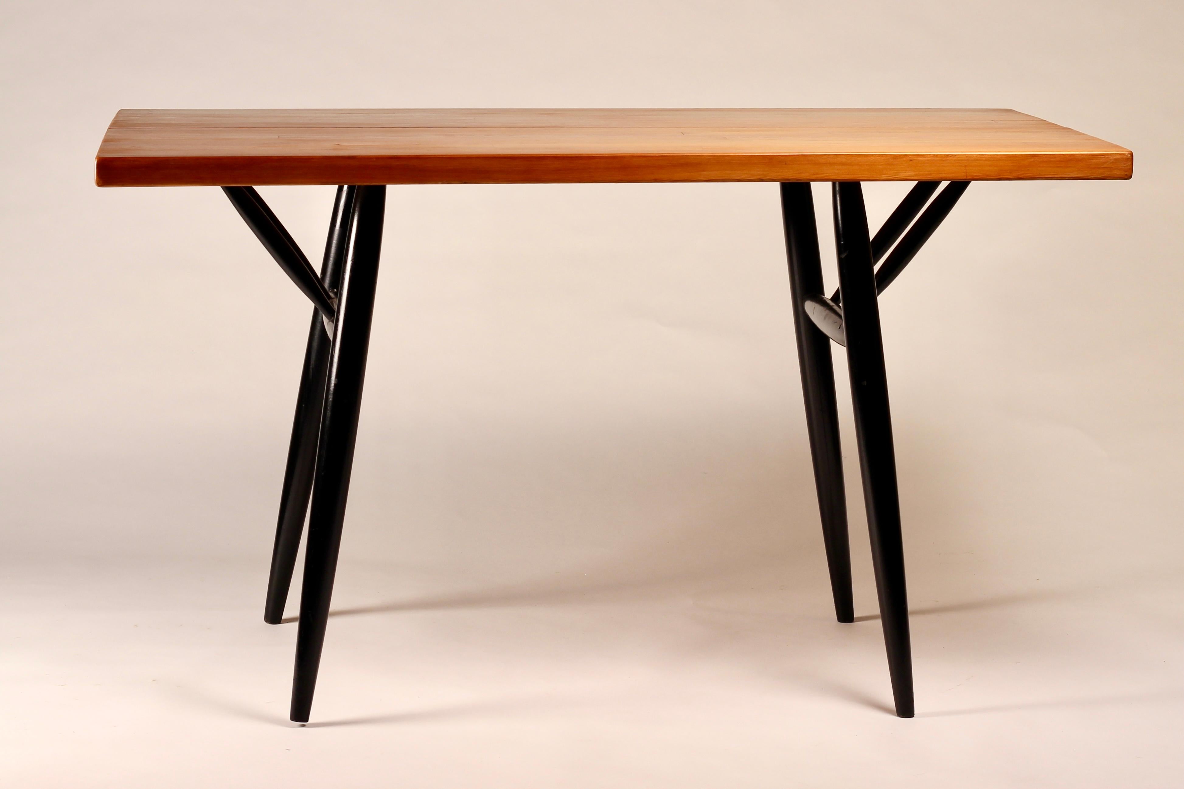 An original and early Ilmari Tapiovaara 'Pirkka' dining Table made from ebonised beech and pine by Laukaan Puu in Finland. 

Designed in 1955, The 'Pirkka' series was produced between 1955-1962. Here, Tapiovaara combines his experience with