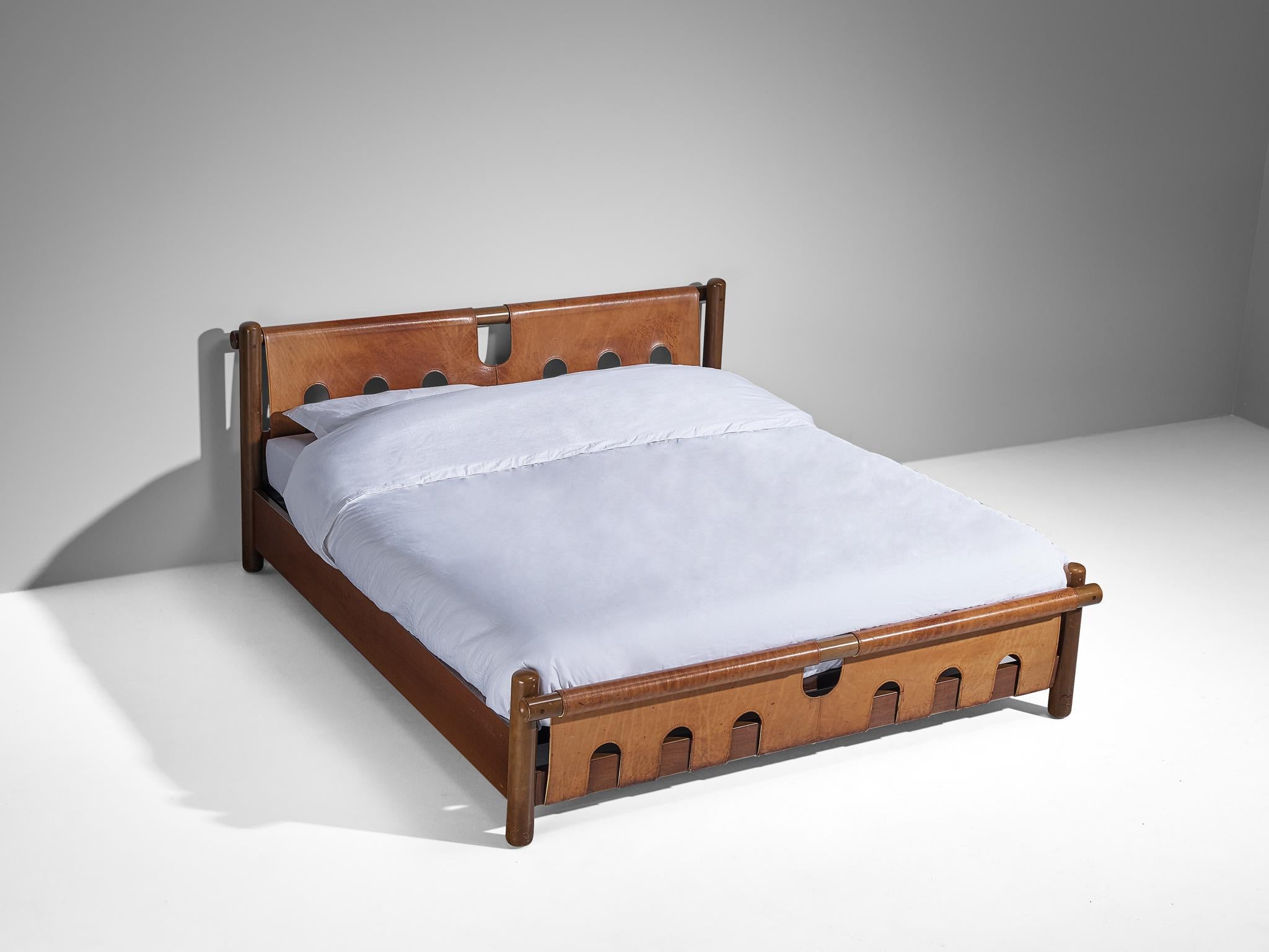 Ilmari Tapiovaara for Esposizione La Permanente Mobili, king bed, walnut, leather, brass, Italy, circa 1960.

This exceptionally rare bed is designed by Finnish designer Ilmari Tapiovaara and was presented at the artisan workshop Esposizione
