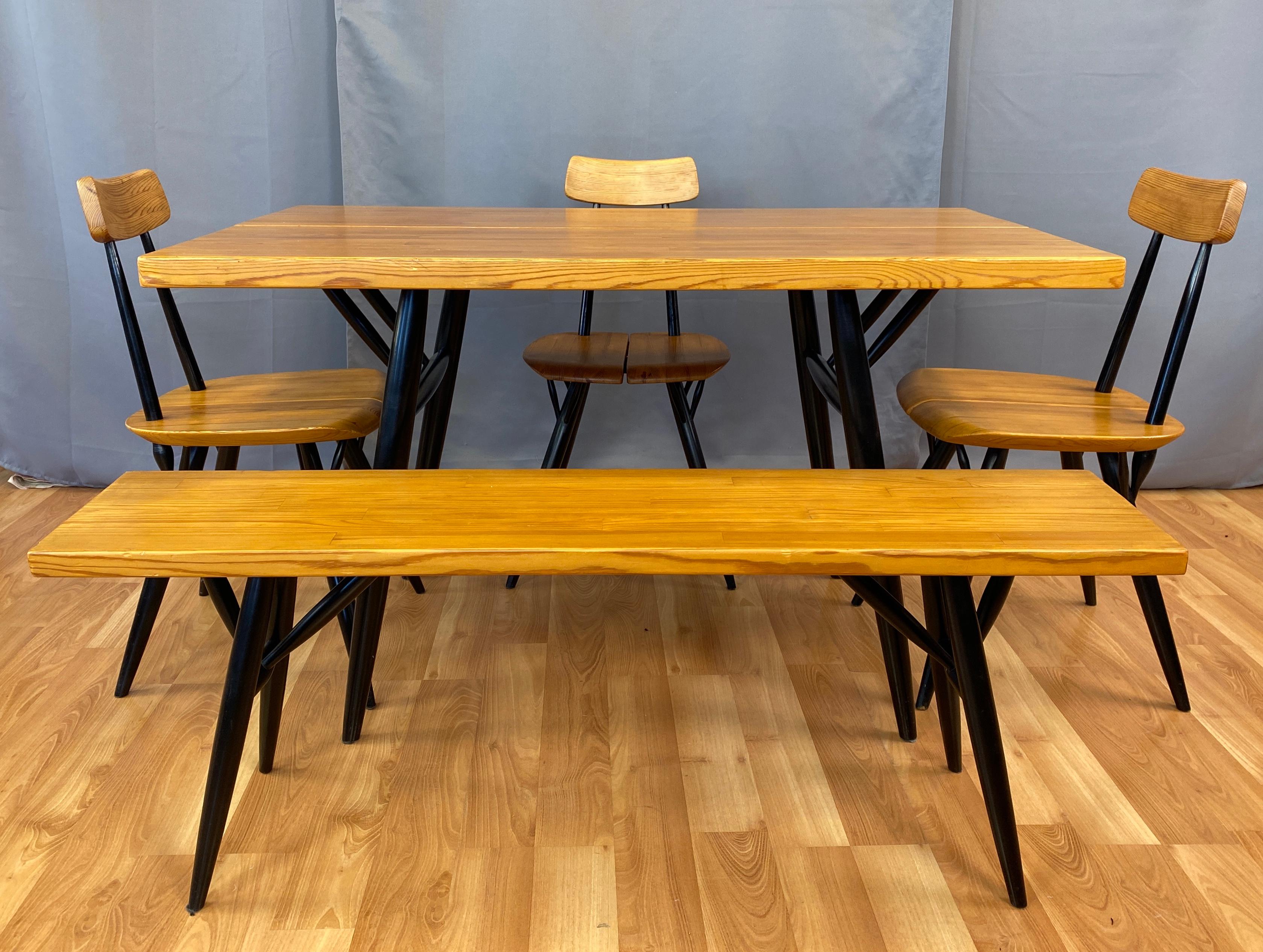 Offered here is a Ilmari Tapiovaara designed dining suite for Laukaan Pu called 