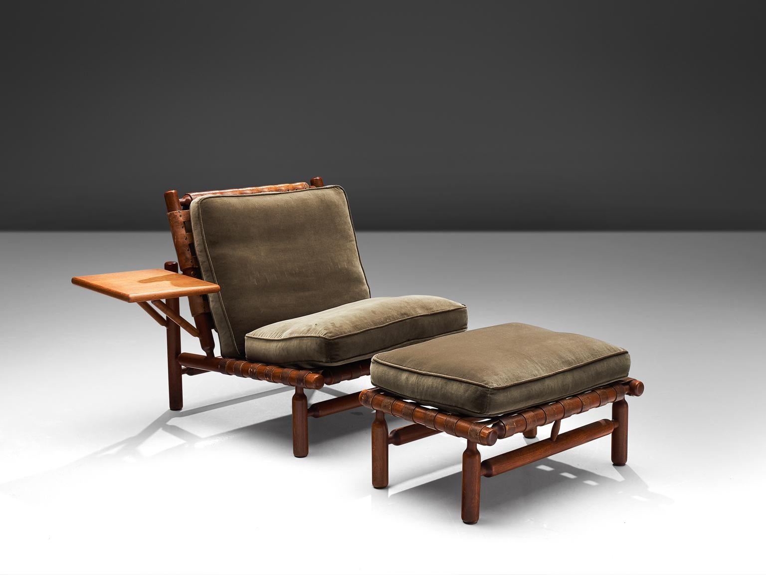 Ilmari Tapiovaara for Esposizione La Permanente Mobili, lounge chair and ottoman, teak and leather, Italy, 1957. 

This rare set with chair and ottoman are designed by the Finnish designer Ilmari Tapiovaara. This organic design features beautiful