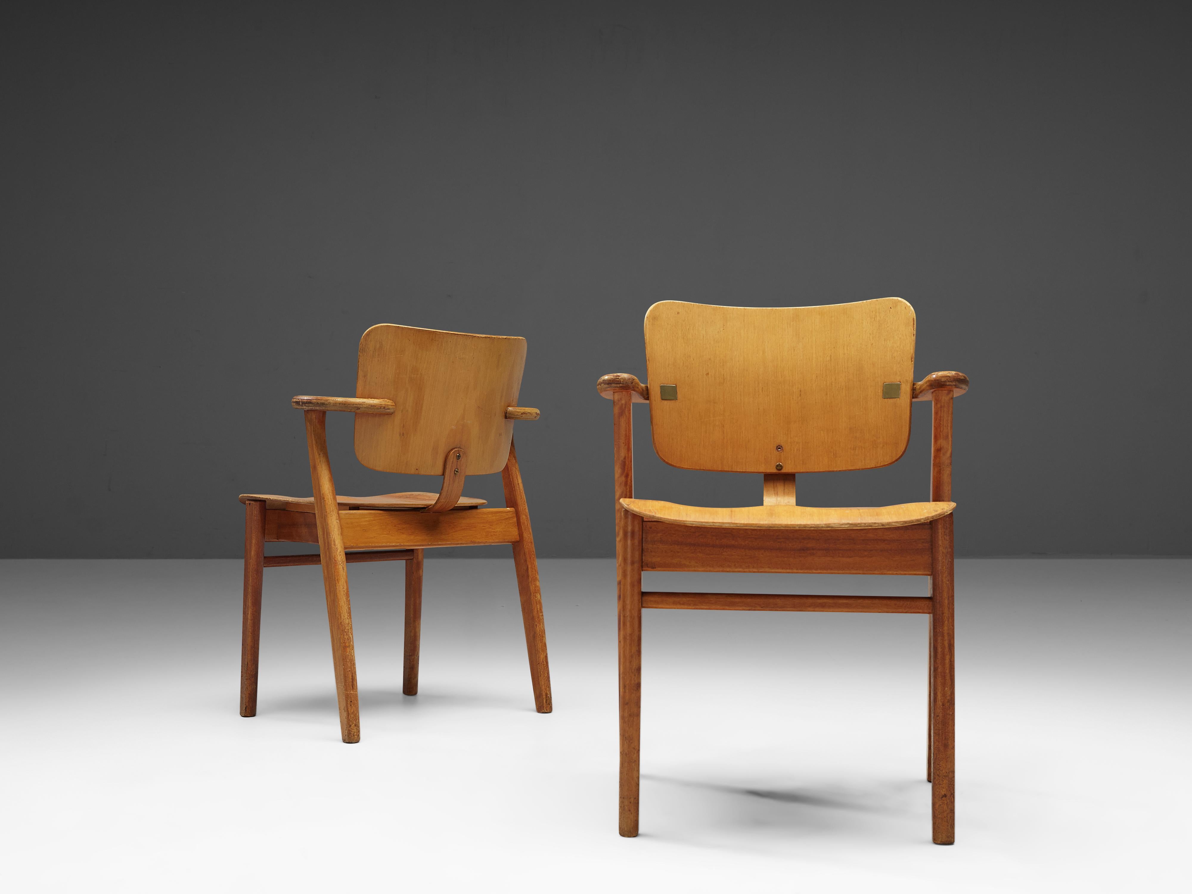 Ilmari Tapiovaara, 'Domus' armchairs, birch, metal, Finland, design 1953

This is a wonderful pair of early ‘Domus’ armchairs by Finnish designer Ilmari Tapiovaara. The frame is made from solid birch. Back and seating from laminated plywood. This