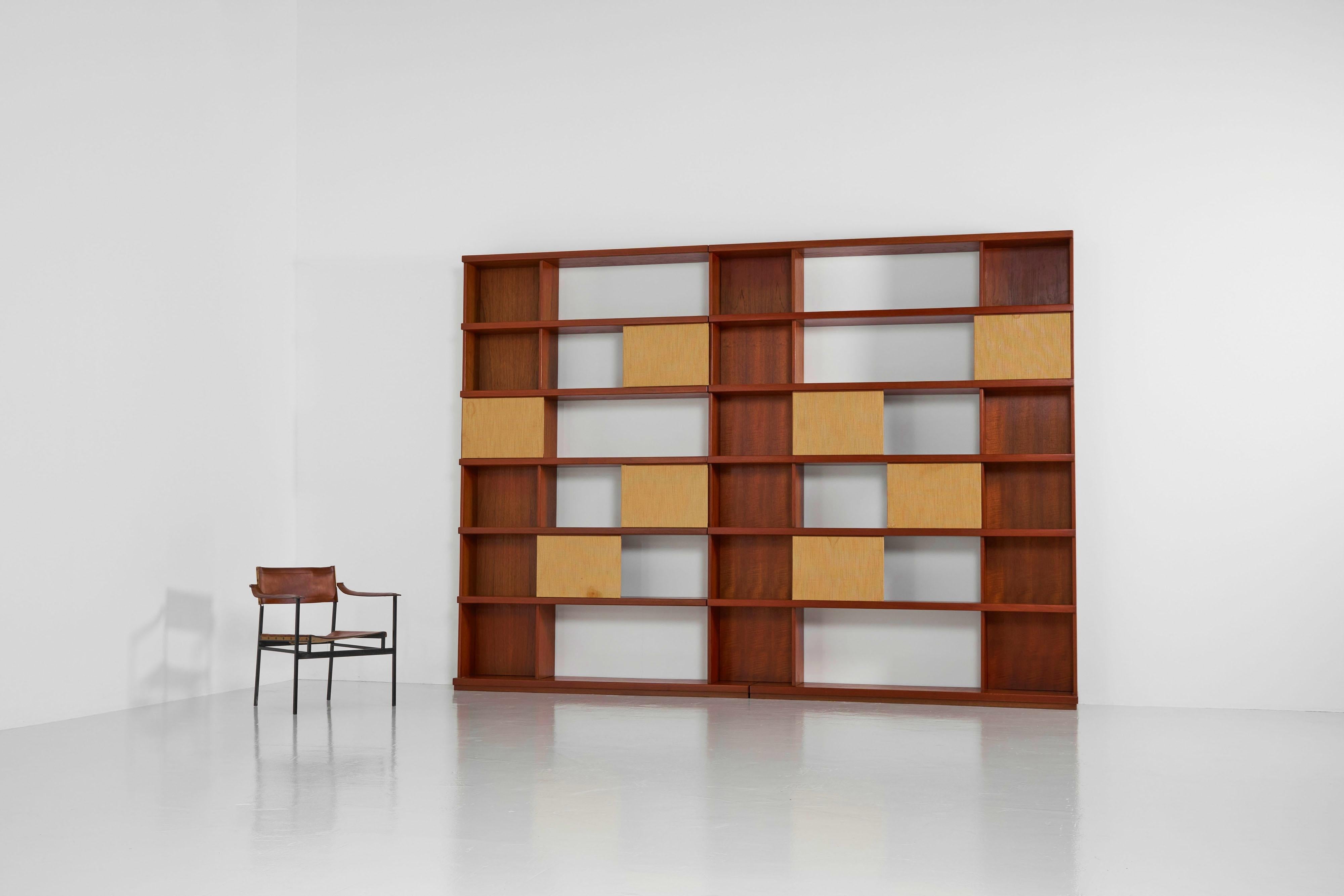 This monumental bookcase was designed by Ilmari Tapiovaara and manufactured by Permanente Mobili Cantu, Italy 1957. The grand sized bookcase is executed in teak wood which has a nice deep and warm colour. This bookcase can be used as a showcase as