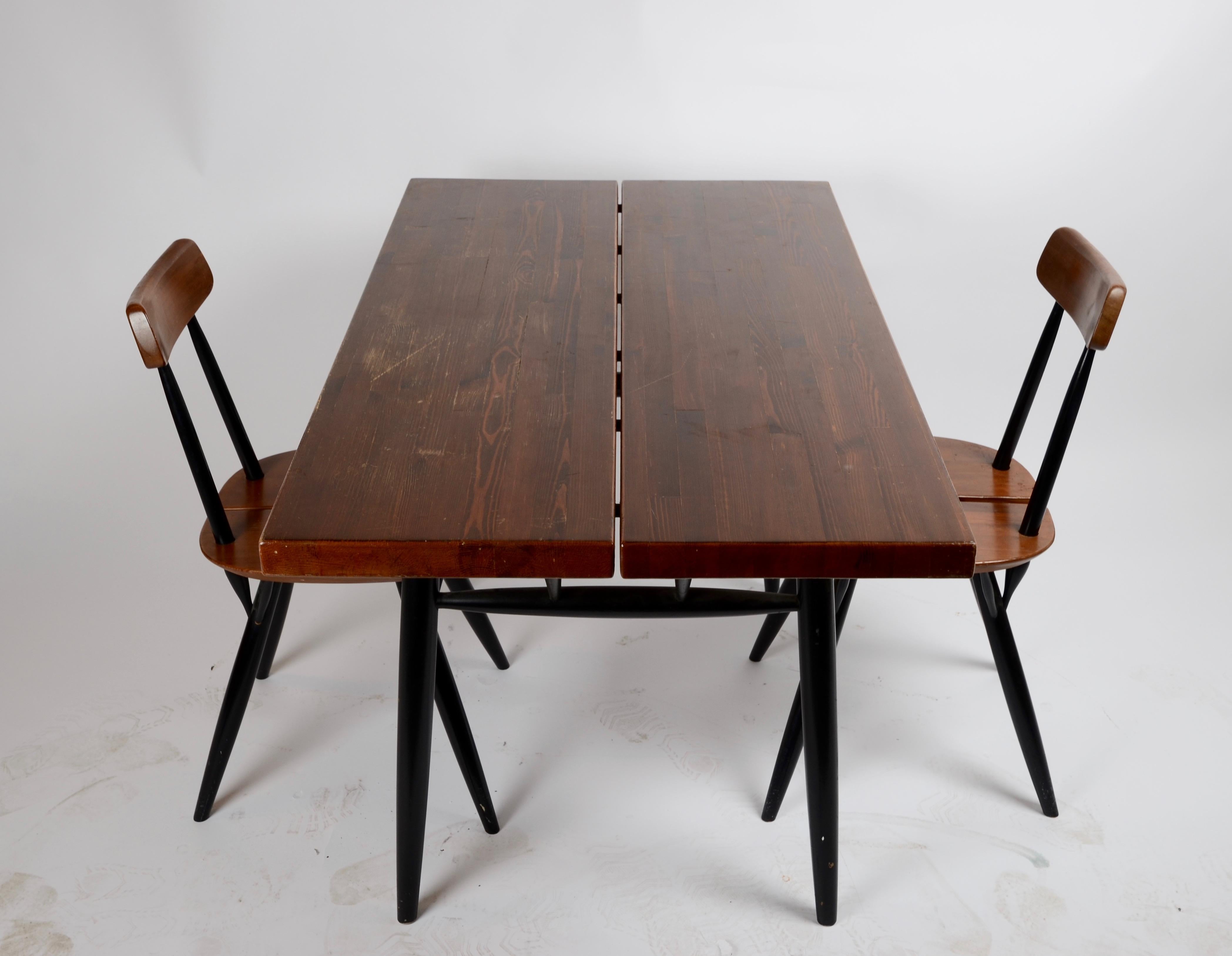 Dining set with table and three chairs, model Pirkka. Designed by Imari Tapiovaara, Finland, 1970s.

  