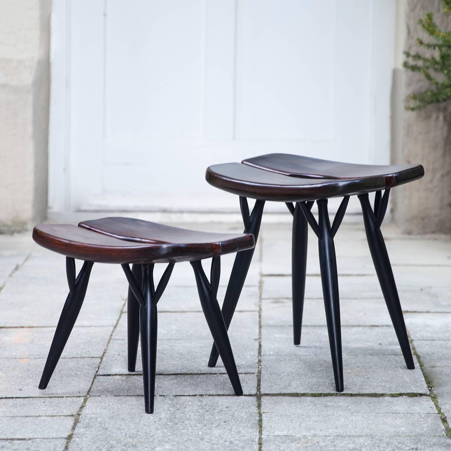 Ilmari Tapiovaara designed this Pirkka stools in the 1950s. The black legs and seats in stained pine result in a timeless Finnish design. The normal size Pirkka stool is made by Asko and rare low sauna stool is made by Laukaan Puu and the height of
