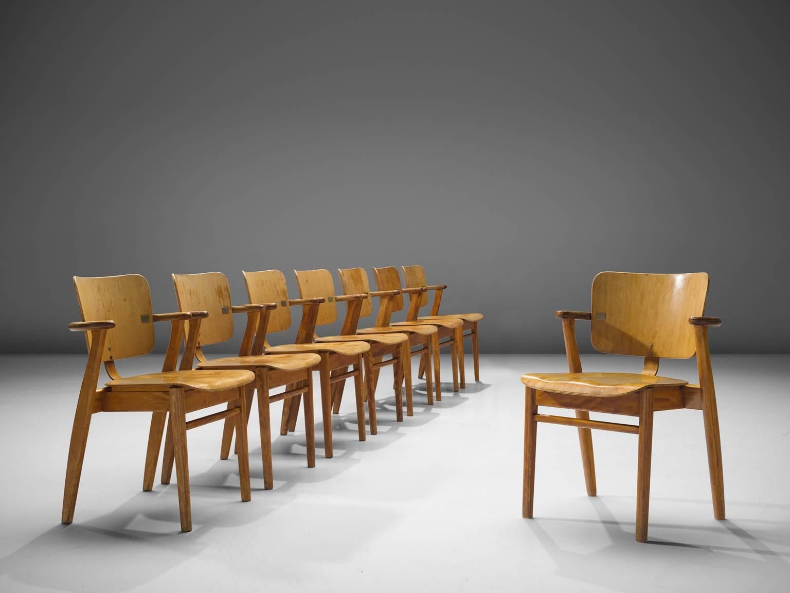 Ilmari Tapiovaara, set of eight 'Domus' armchairs, in birch and brass colored metal, Finland, 1953. 

This is a large set of early Domus armchairs. The frame is made from solid birch. Back and seating from laminated plywood. This model was designed