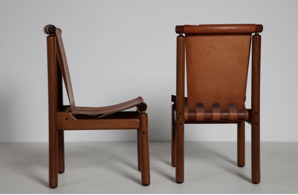 Set of eight dining chairs designed by Ilmari Tapiovaara for La Permanente Cantù, (1950).
Chairs with wooden structure and leather seat and back.
Production La permanente Cantù, circa 1950, Italy.
Size: 48 x 58 x 90 cm (each).