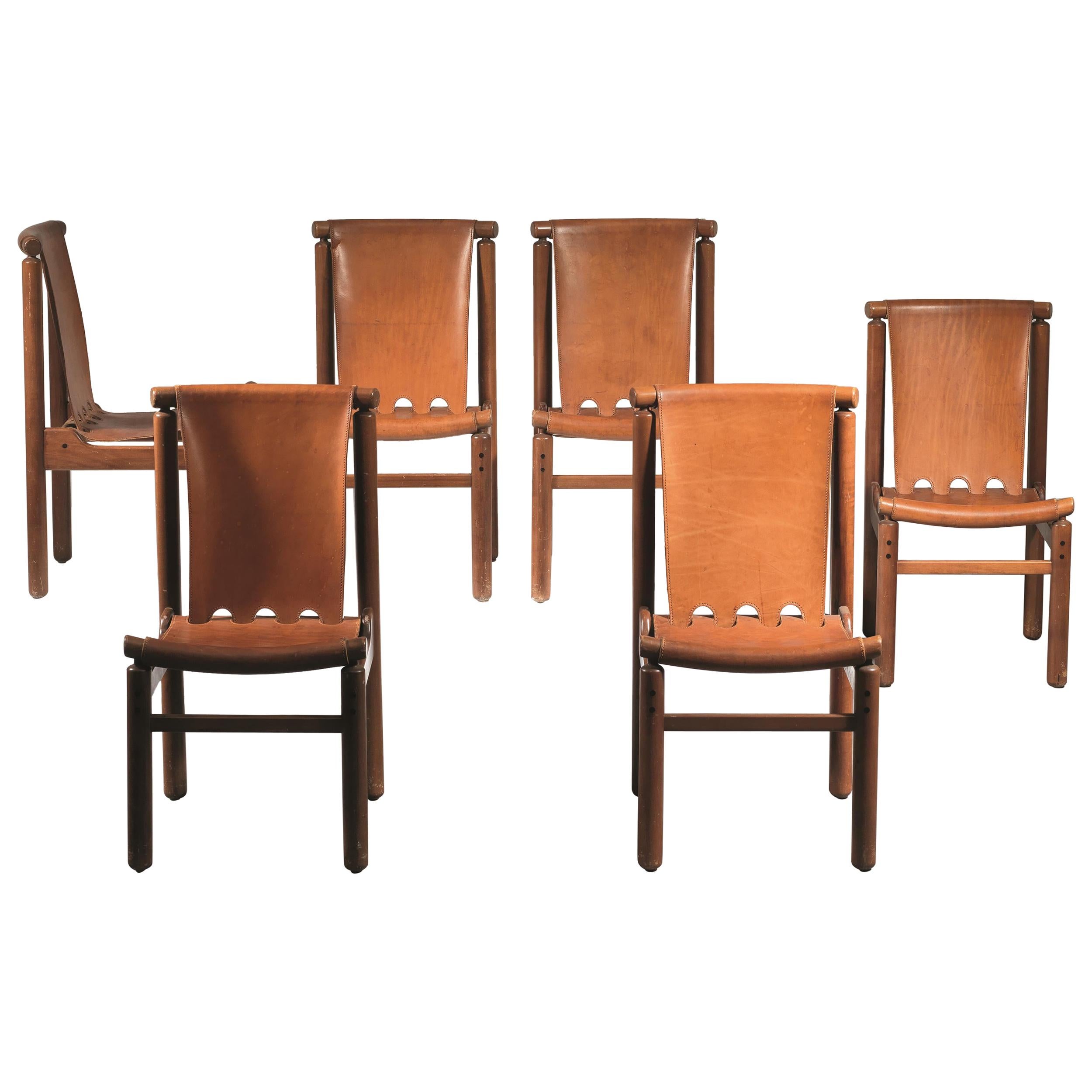 Set of ten dining chairs designed by Ilmari Tapiovaara for La Permanente Cantù, (1950).
Chairs with wooden structure and leather seat and back.
Production La permanente Cantù, circa 1950, Italy.
Size: 48 x 58 x 90 cm (each).
 