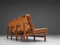 Canapé à trois places Ilmari Tapiovaara en cuir cognac et teck