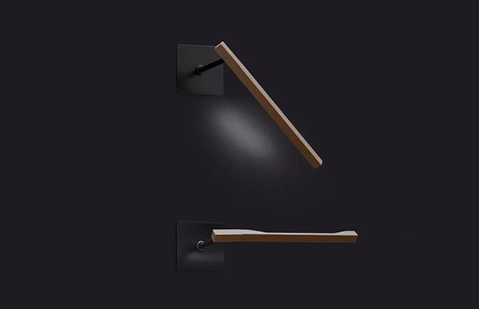 Ilo Wall Lamp by David Lopez Quincoces for Oluce. The simplicity in the design and the lightweight makes the lamp a remarkable piece for functional design. The light source is housed in a chromed bar which is slender in design and mounted on the