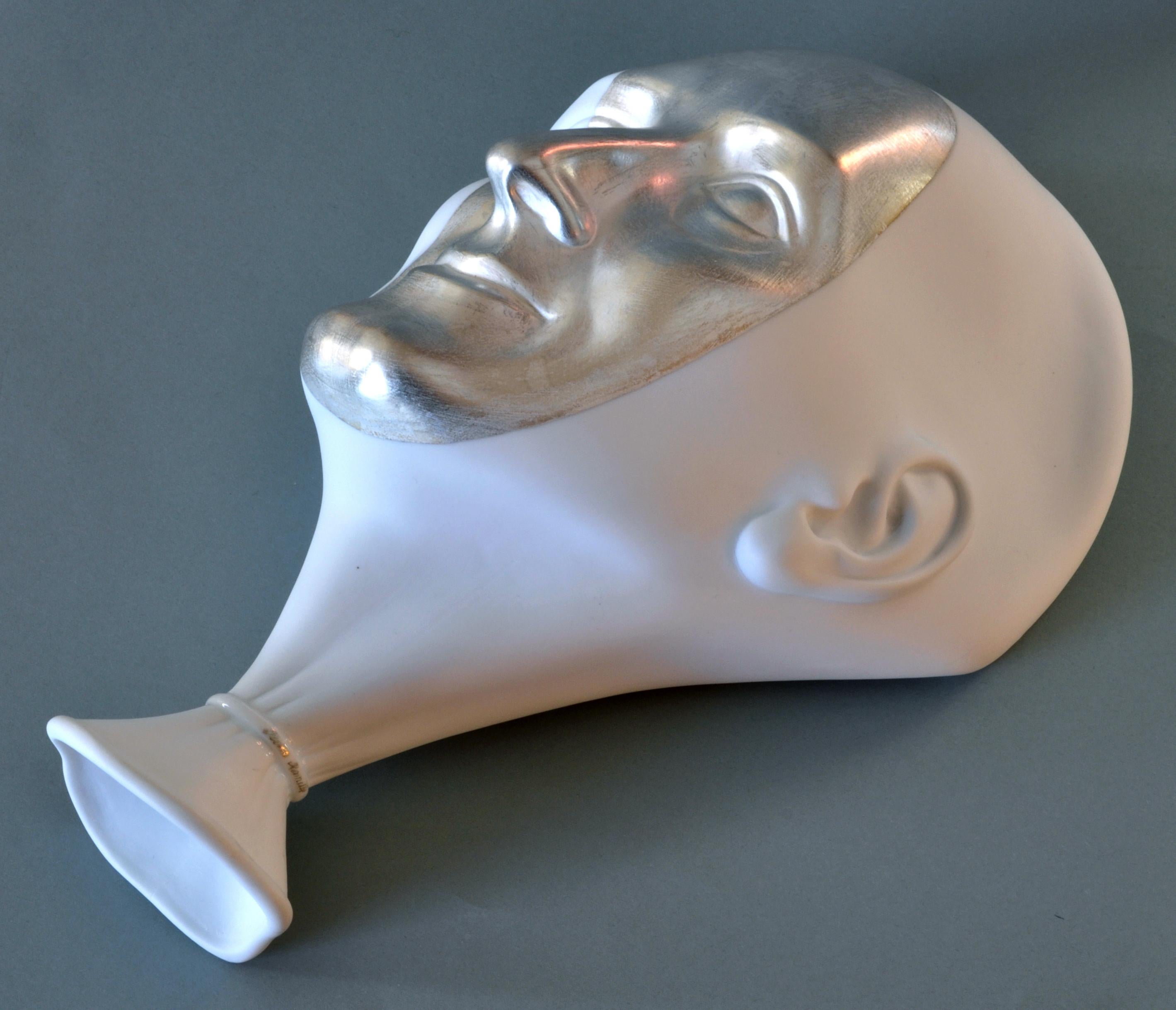 Wall Decor - a silver mask

Porcelain, silver, h 26 cm
by Ilona Romule, leading sculptor in Latvia

The 