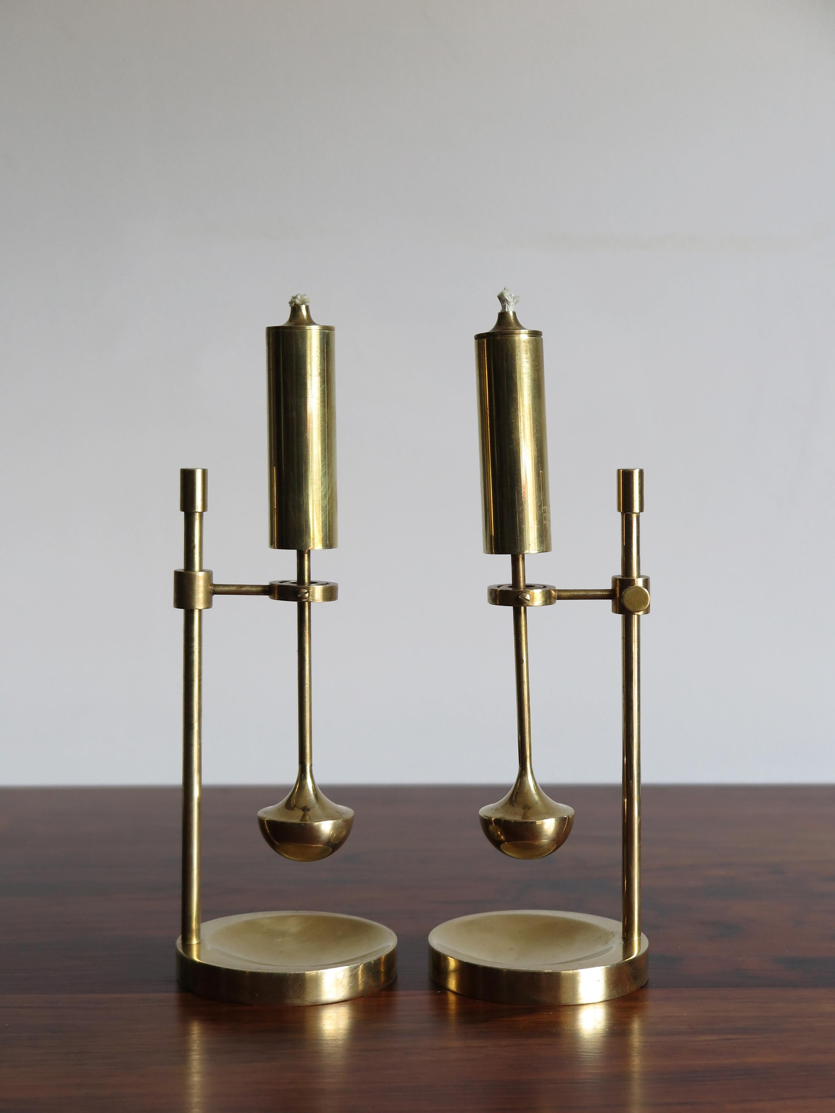 Daproma Denmark Ilse D. Ammonsen design brass ship oil lamps, adjustable height and flame, brass metal and oil wick , circa 1950s
Signed under the base.

Please note that the lamps are original of the period and this shows normal signs of age and