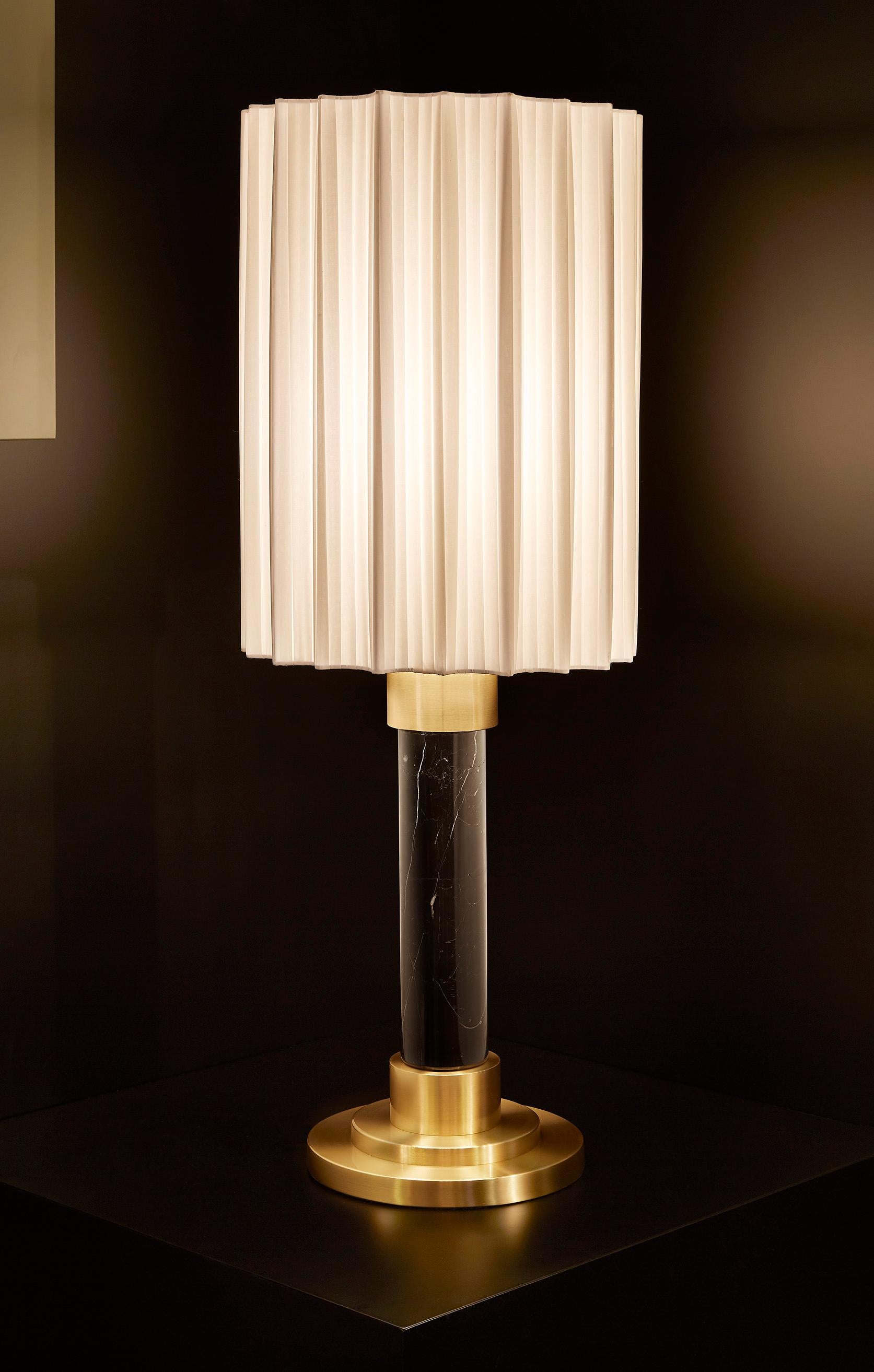 Black marble and brushed brass table lamp, with cotton fabric pleated shade.
Shade Dia: 300mm
Shade Height: 450mm
Overall Height: 880mm
Base Dia: 250mm
Height of Marble: 280mm

Made to order to buyer's specification. Variations to finishes