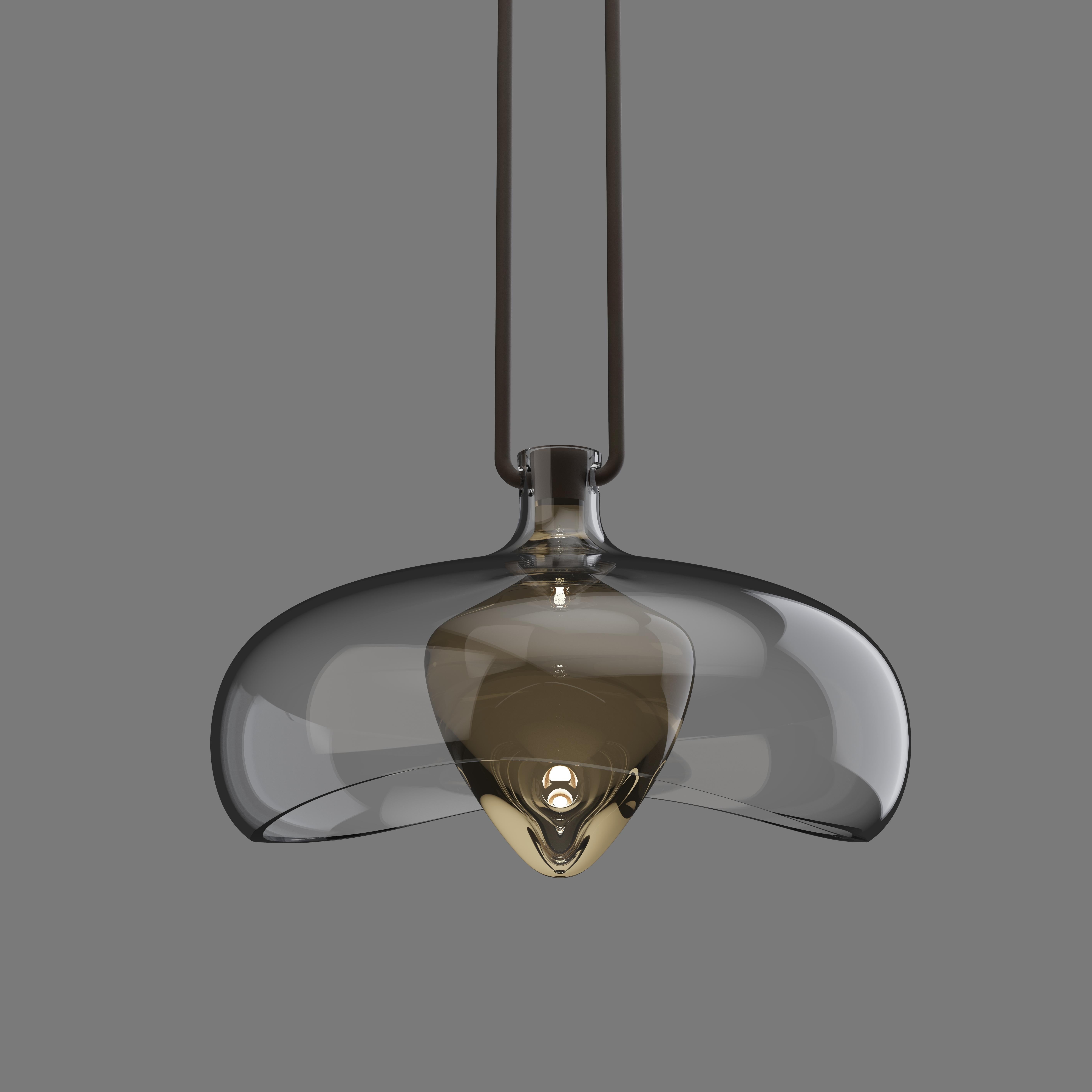 Pendant in dark bronze finish with decorative solid gold glass and clear glass bowl. 

Overall Dia: 399mm 
Glass Shade Height: 230mm 
Integrated LED, 2700k

Made to order to buyer's specification. Variations to dimensions and finishes can be made on