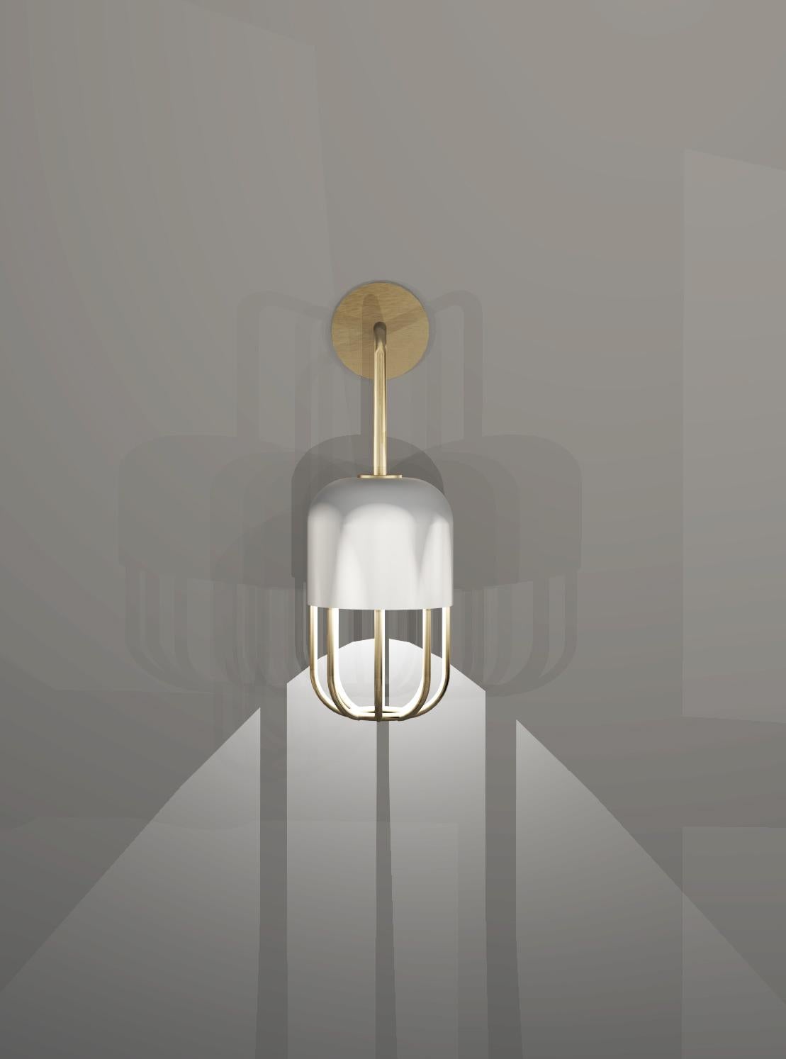 This wall light has a bold design that uses symmetry between the outer casing and the frame of a capsule shape. The soft glow of opal glass is elegantly supported and highlighted by a beautiful brushed brass structure.
Metalwork can be powder-coated