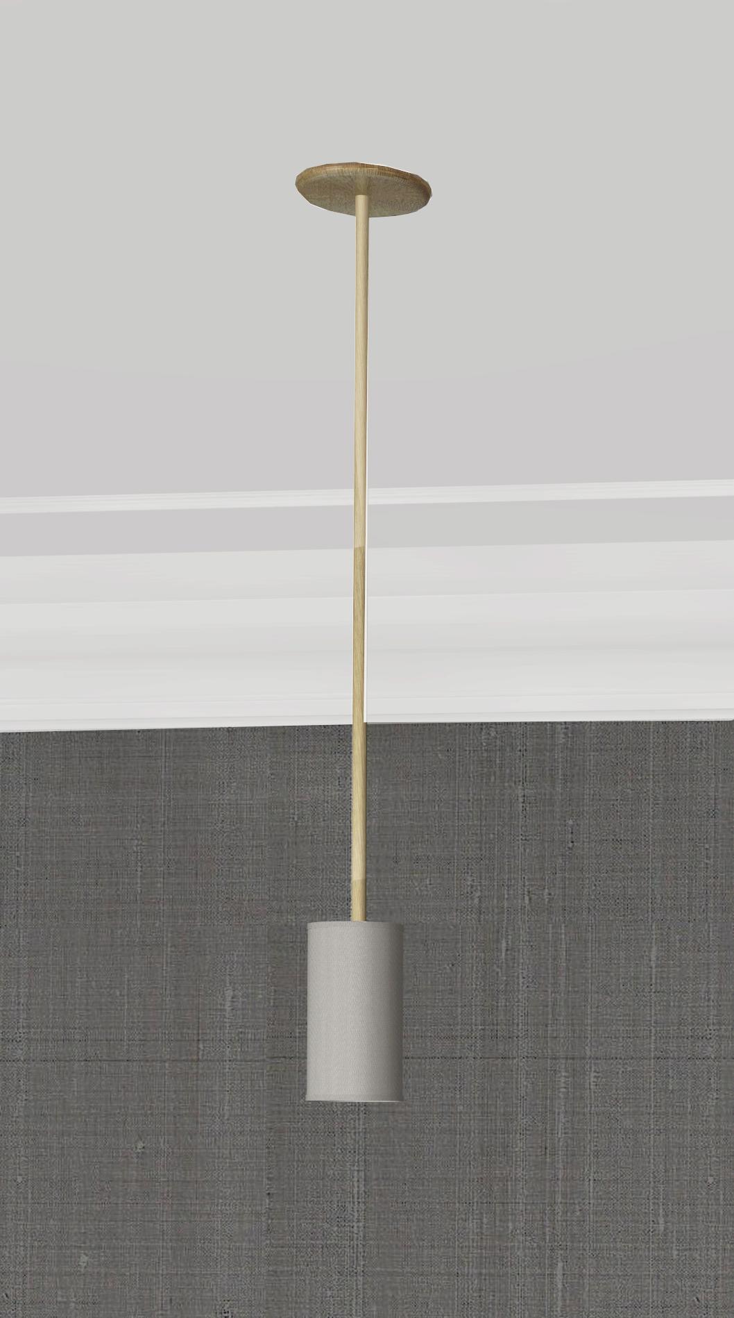 This pendant is a modern take on tradition. Beautifully crafted with elegant materials including brushed brass and sateen shades. The tall, timeless shades add a modern touch to the classic motif base, giving a familiar, yet forward looking
