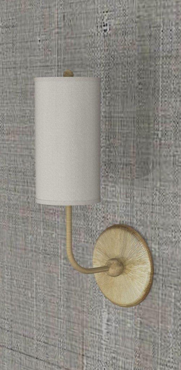 This wall light is a modern take on tradition. Beautifully crafted with elegant materials including brushed brass and sateen shades. The tall, timeless shades add a modern touch to the classic motif base, giving a familiar, yet forward looking
