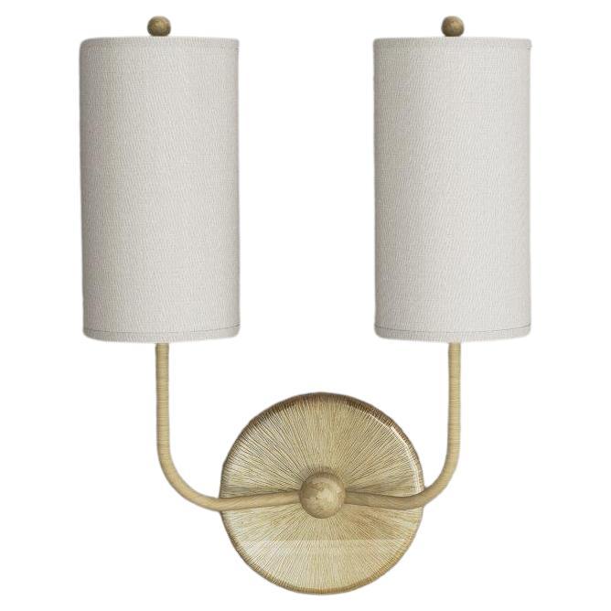 This wall light is a modern take on tradition. Beautifully crafted with elegant materials including brushed brass and sateen shades. The tall, timeless shades add a modern touch to the classic motif base, giving a familiar, yet forward looking