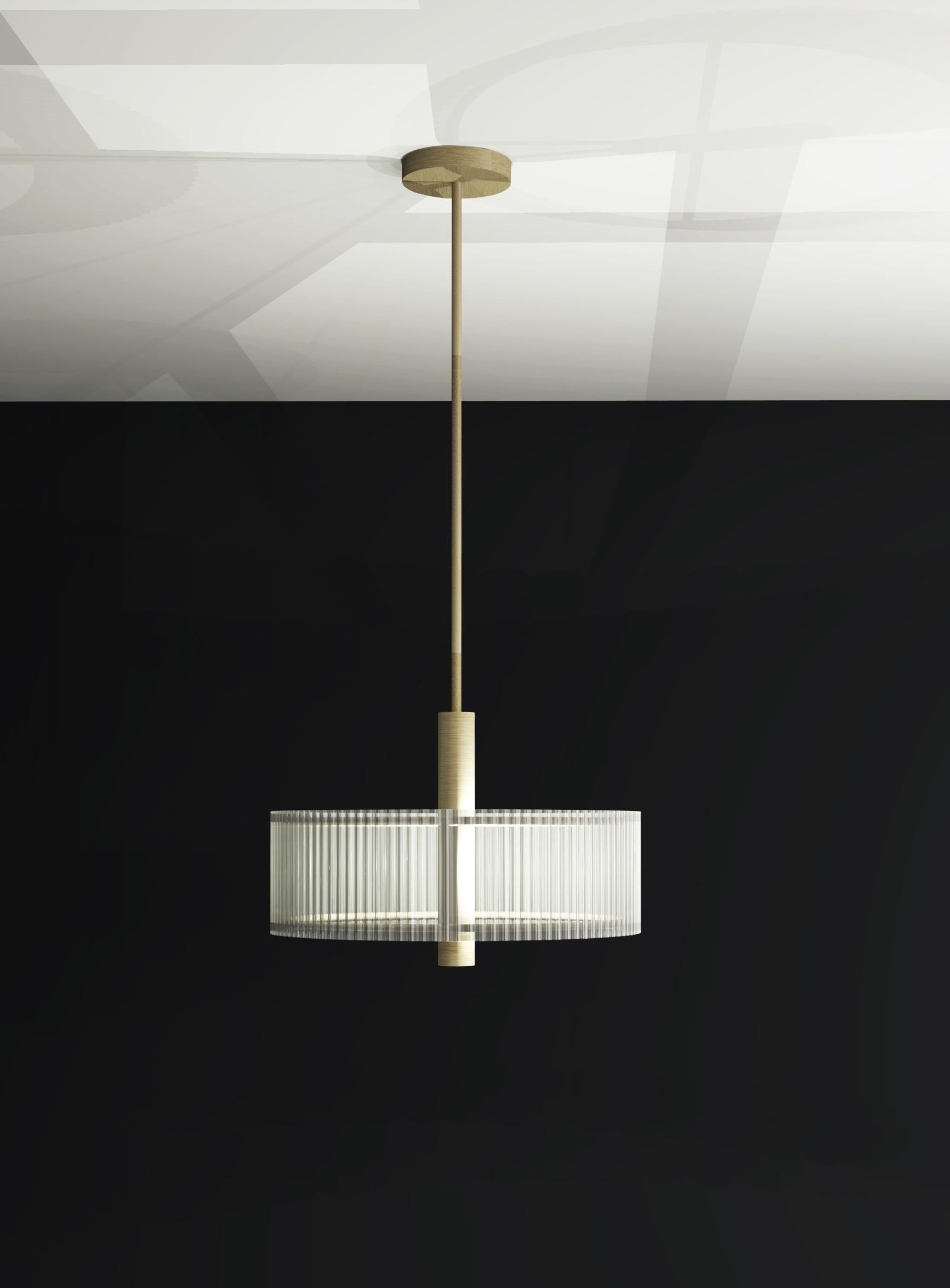 Contemporary pendant with fluted glass shade and brushed brass metalwork.

Diameter: 360mm
Shade Height: 120mm
Overall Height: 820mm

Made to order to buyer's specification. Variations to dimensions and finishes can be made.