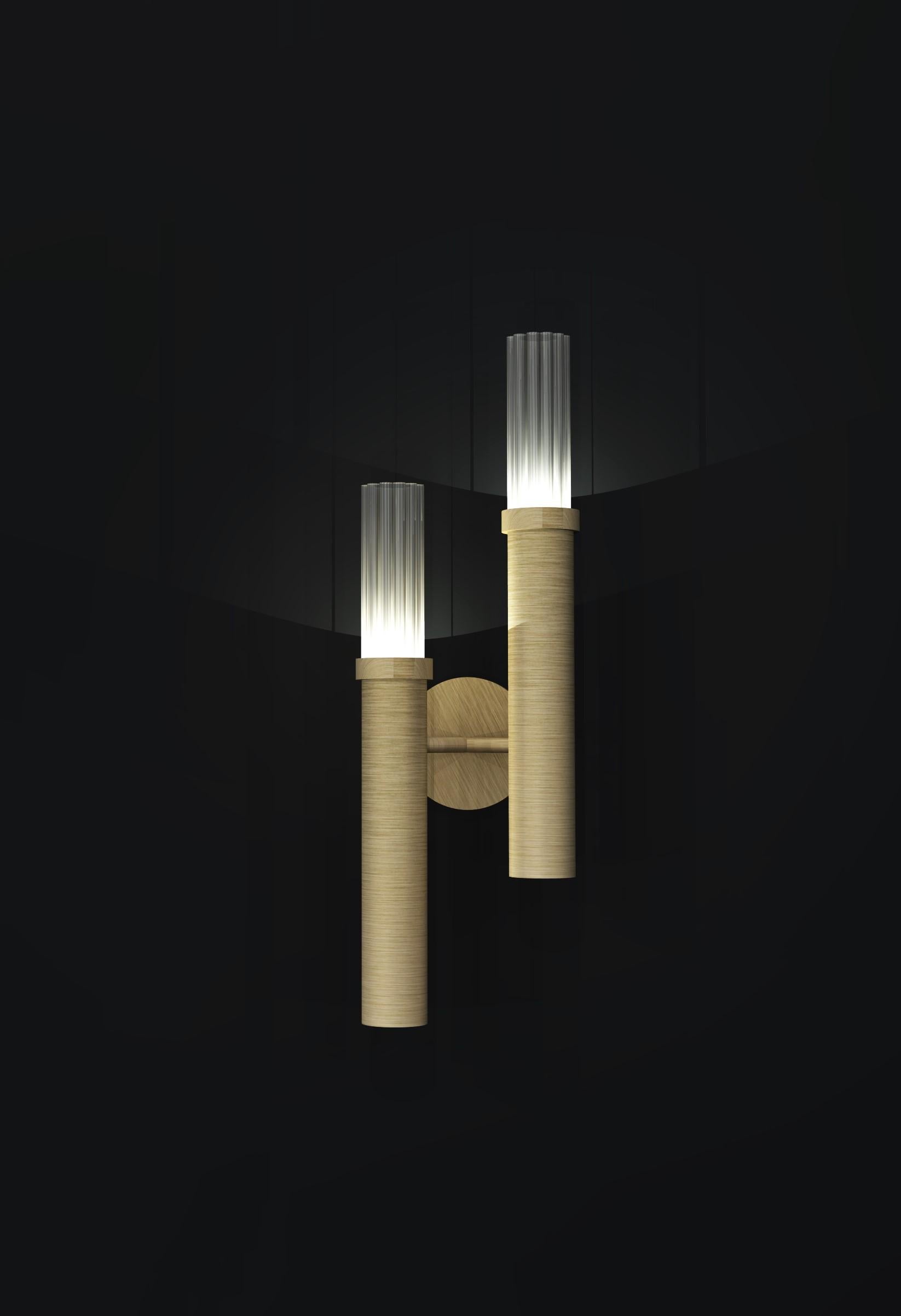 Contemporary Wall Light in fluted glass and brushed brass finish.

Width: 180mm
Height: 400mm
2 x G9 lampholders (w/o bulbs)

Made to order to buyer's specification. Variations to dimensions and finishes can be made.