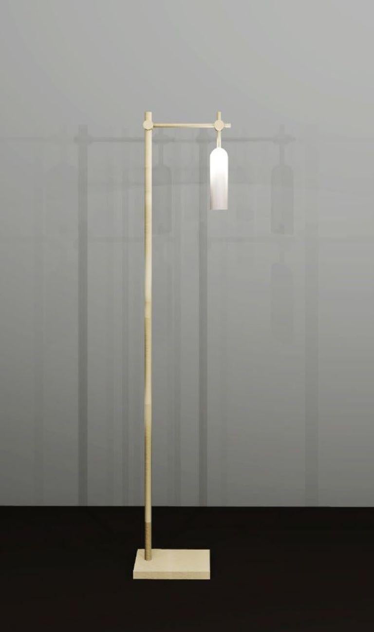 Elegantly simple, this floor lamp pairs light brass with frosted glass to create a delicate, subdued design.

Glass shade dia: 45mm 
Height: 170mm 
Overall Height: 1300mm

Made to order to buyer's specification. Variations to dimensions and finishes