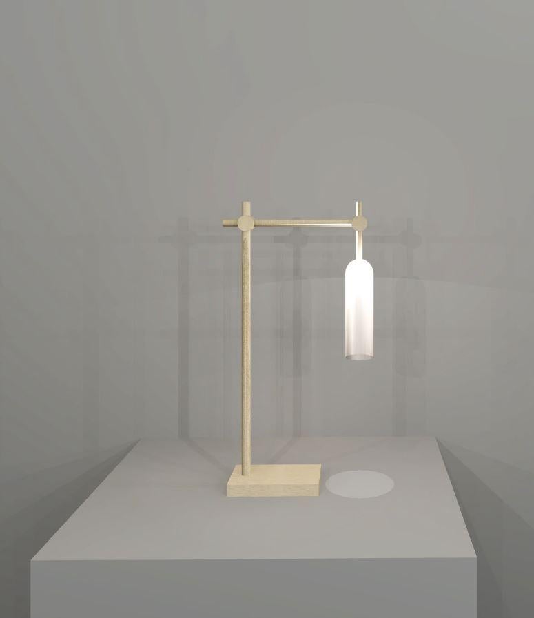 Elegantly simple, this table light pairs light brass with frosted glass to create a delicate, subdued design.

Overall height: 480mm
Shade Height: 170mm
Shade Diameter: 45mm

Made to order. Variations to dimensions and finishes can be made.
