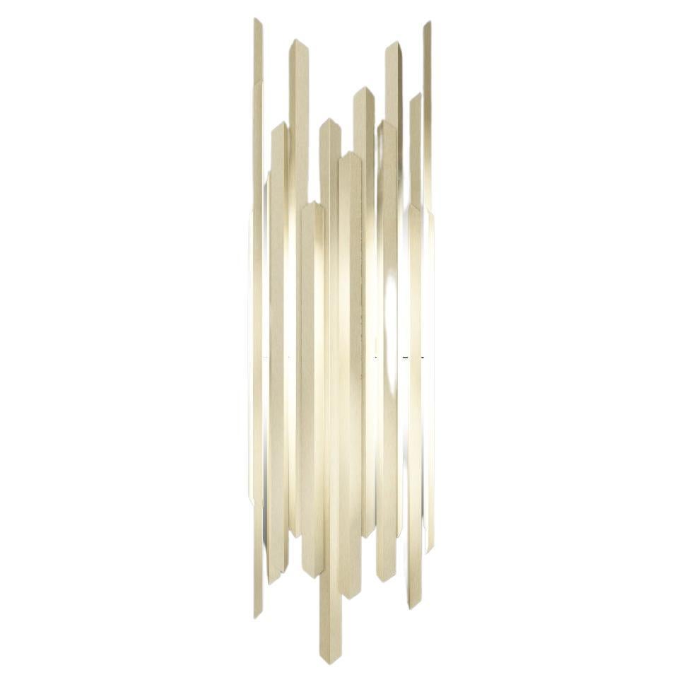 This wall light is part of a visionary collection that uses the exceptional qualities of brass and the fascinating formation of ice shards to create a chic and unusual collection of lighting perfect for giving an exclusive feel to any