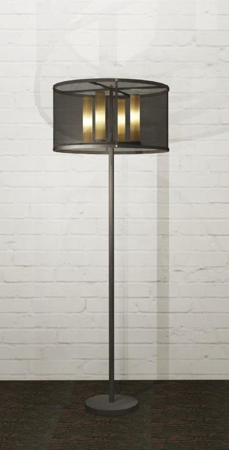 This floor lamp is made from two types of metal: antique bronze and antique brass. The light source is concealed with an antique brass mesh, while outer shade with antique bronze mesh. The main idea for this design was continuously layering of