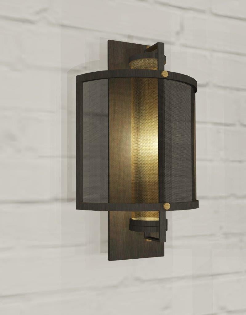 This wall light is made from two types of metal: antique bronze and antique brass. The light source is concealed with an antique brass mesh, while outer shade with antique bronze mesh. The main idea for this design was continuously layering of