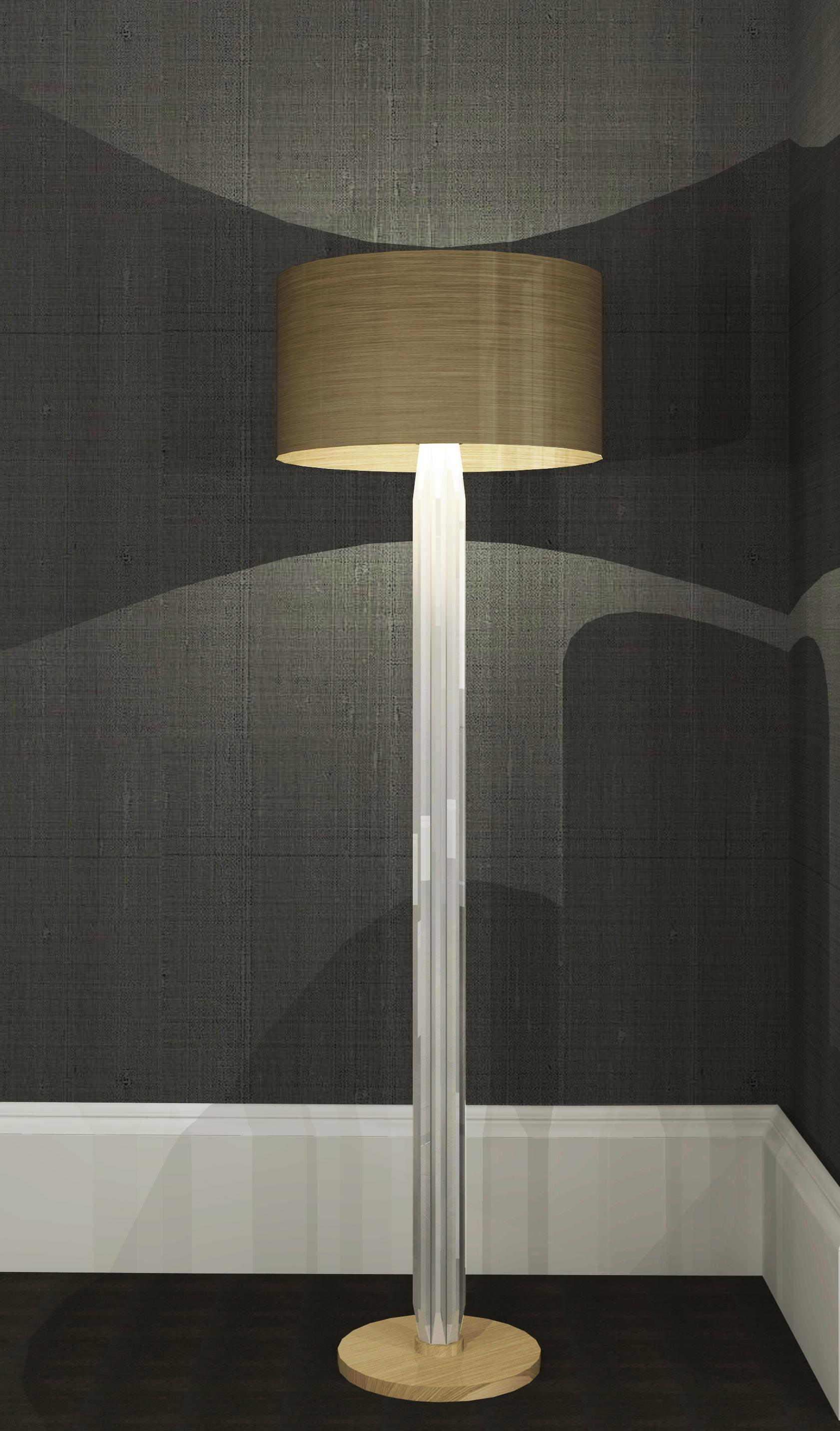 This floor lamp uses a mix of bold materials, brushed brass band and over-sized crystal elements, to give impact whilst remaining clean and classic. The designs cool, clean, beveled-edge crystals give a beautiful reflection and transparency, whilst