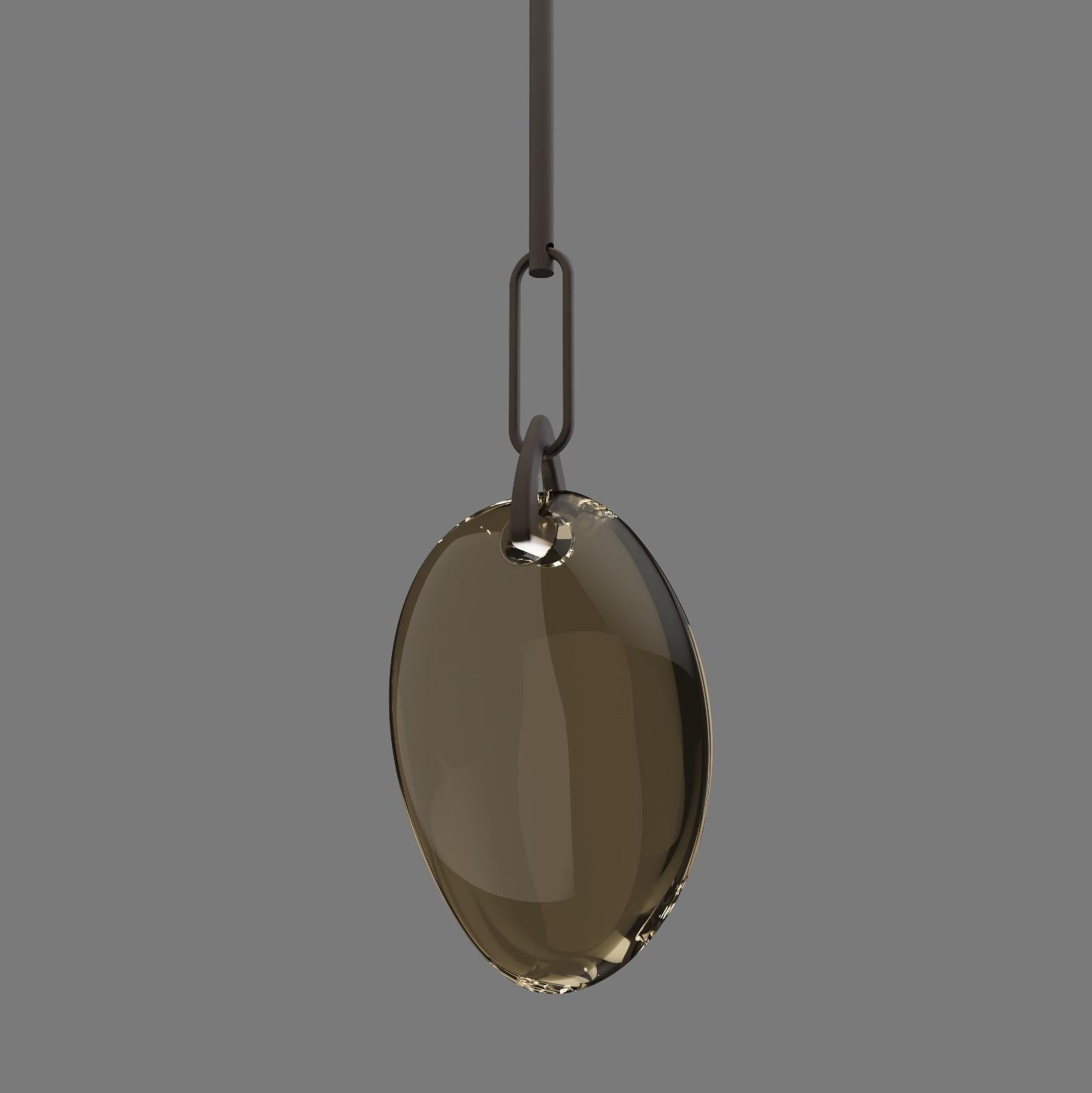 Hand blown glass pendant in bronze coloured glass and metalwork in dark bronze finish. Available in 3 sizes to create stunning clusters or feature fittings.

Finish: antique brass or dark bronze and coloured glass.
Light Source: Integrated LED
Glass