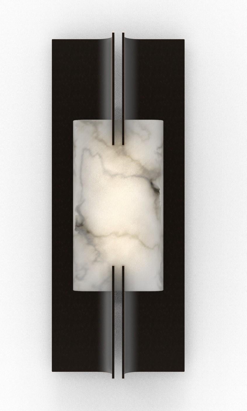 Wall Light with alabaster and matt black metalwork. 

Height: 450mm 
Width: 180mm 
Depth: 70mm
Integrated LED.

Made to order. Variations to dimensions and finishes can be made on request.