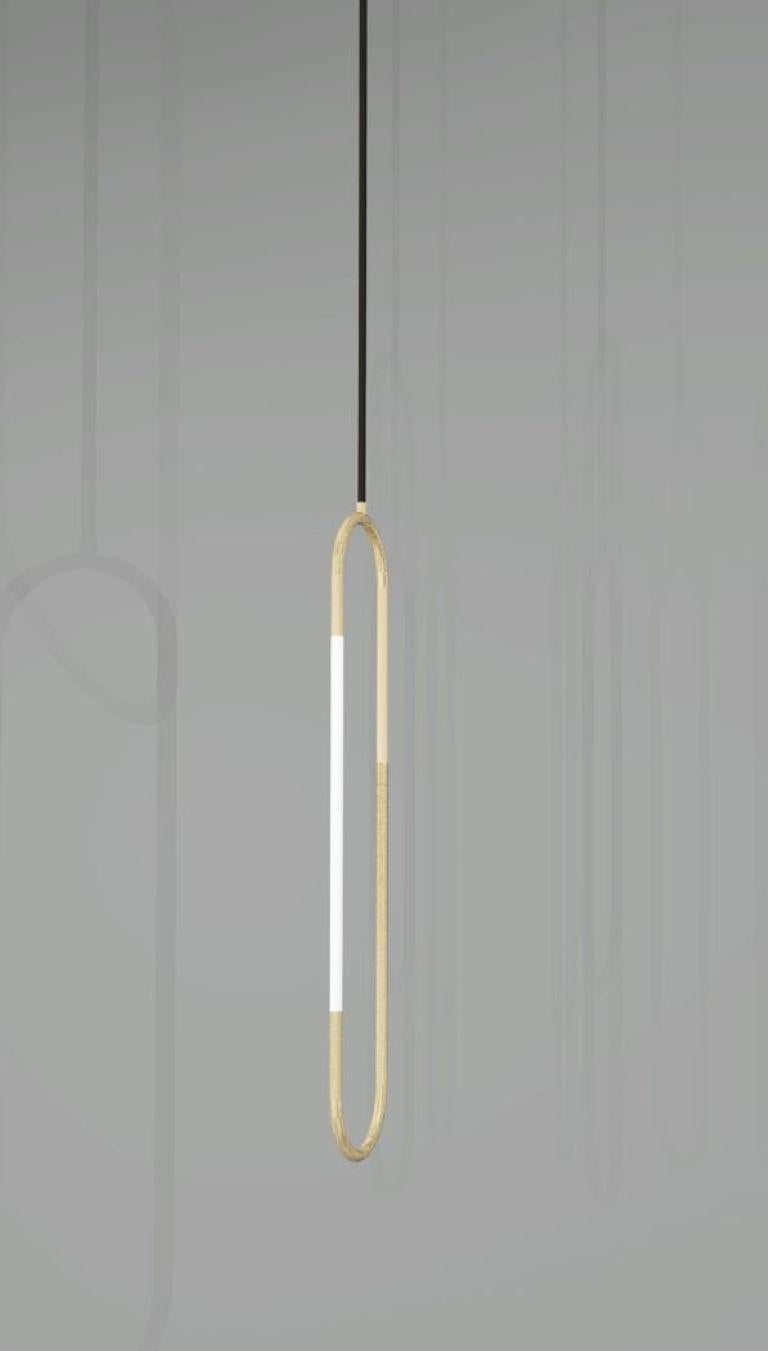 This pendant is based on infinite loops of brass, coiling continuously to create a free and fluid structure, with subtly integrated lighting elements.

Height: 500mm 
Width: 10mm 
Rod Diameter: 15mm 
Finishes: brushed brass and opal glass.

Made to