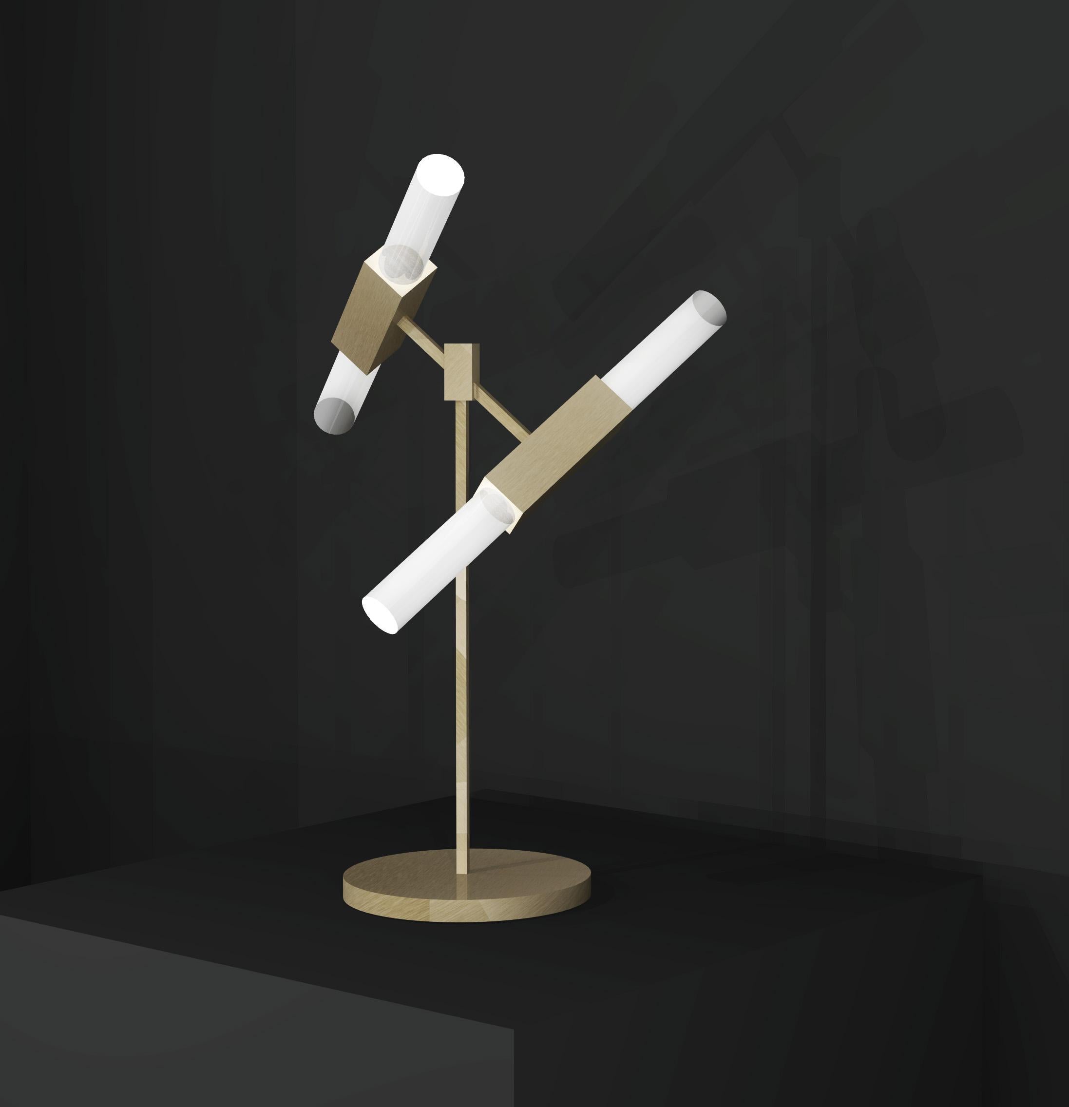 This table lamp is part of a range that was originally designed as bathroom lights and developed into a full collection, created to achieve a timeless design. Using high quality materials including fine brass and glass, a striking, sleek design