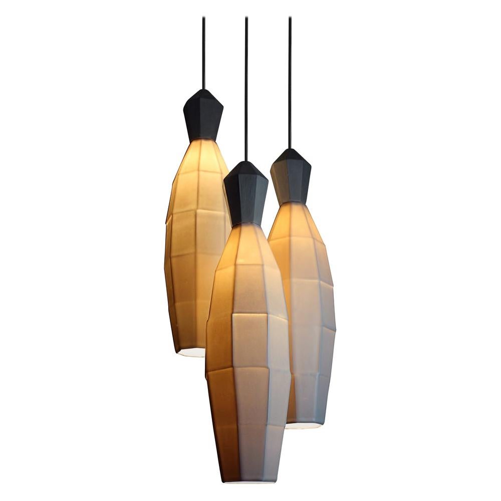 Make the brightest statement with three of the largest geometric translucent porcelain pendants from the Extension collection. Arrange the large clustered hanging pendant lamps to your measurement specifications to bring modern, ambient lighting