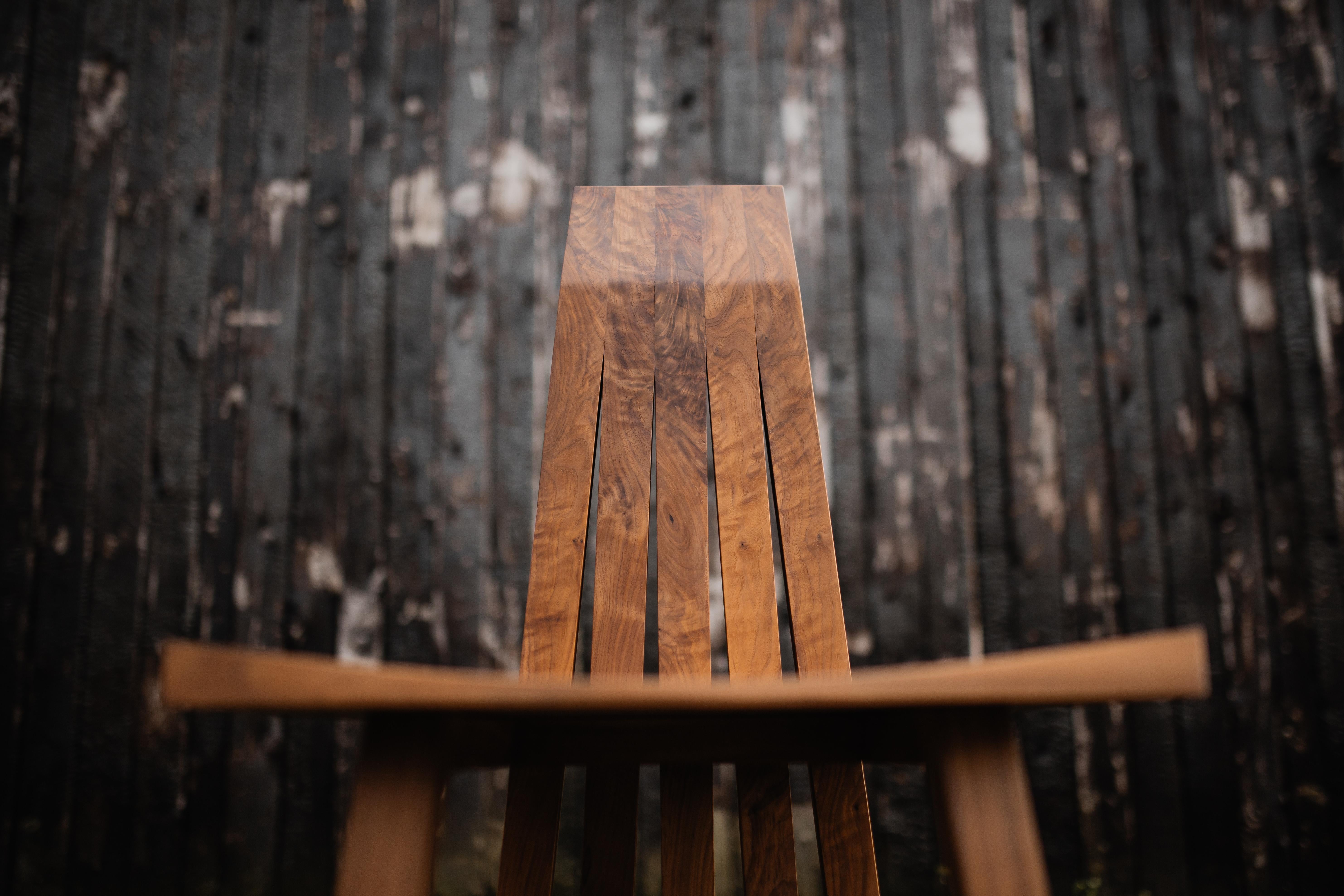 The Imani Dining chair is a hardwood handmade chair, meant to represent boldness. With it’s Brutalist, yet elegant style it makes a statement in a room. This chair was designed from the back as this is the part of the piece that you see most during