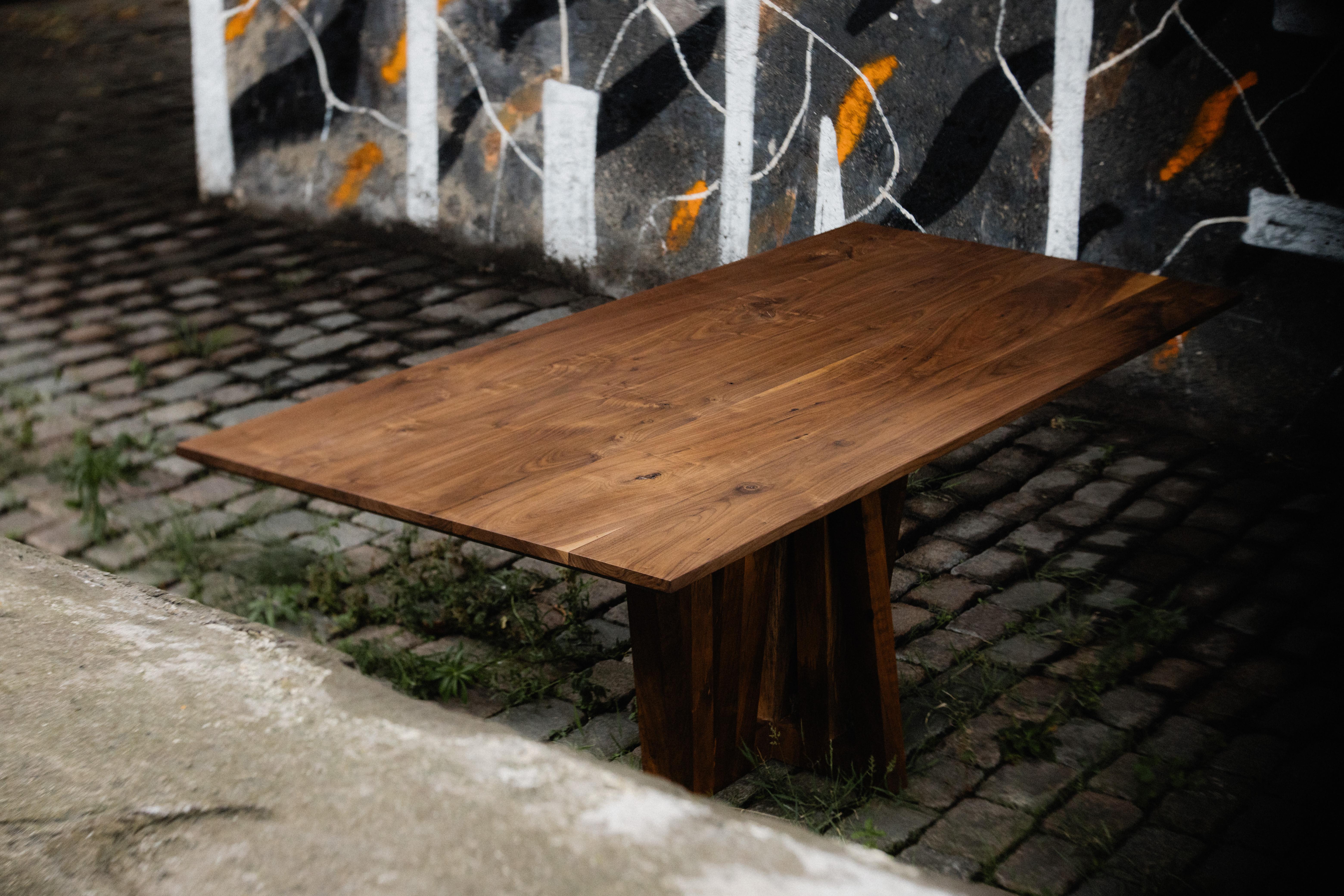The Imani Dining table carries the signature of Albert Potgieter Designs, but displays it in a bold way, taking a step into the Sculptural Furniture world. 

The dining table is made out of hard wood. The sculptural leg is the essence of the piece
