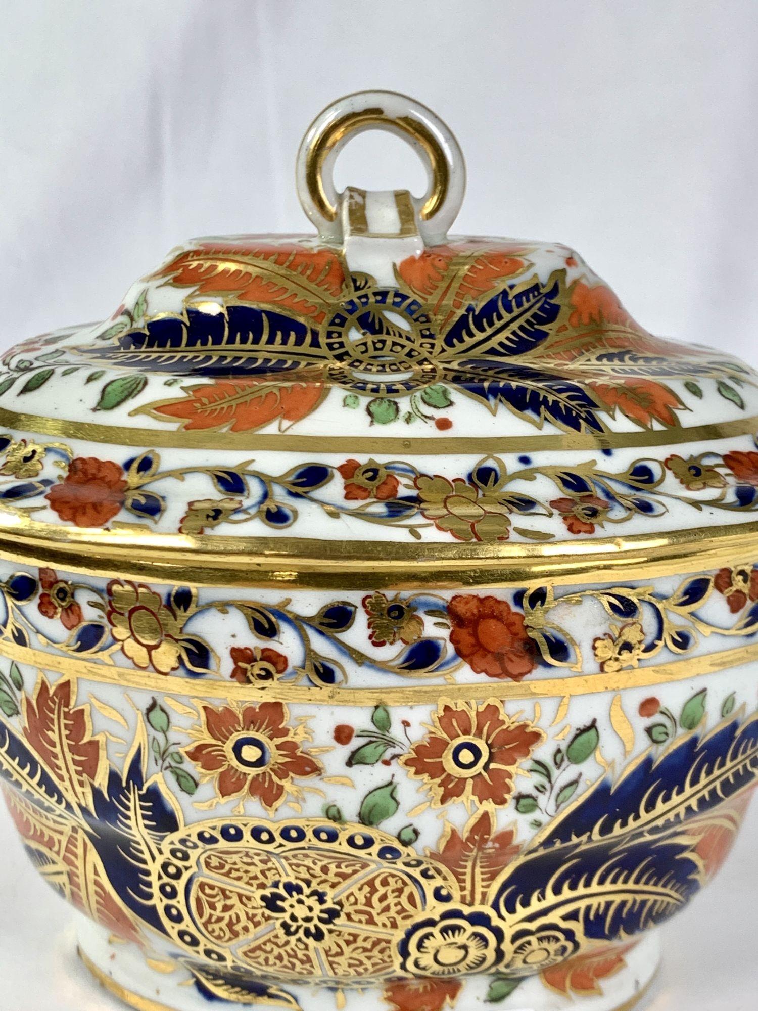 This Chamberlain's Worcester porcelain sugar box is hand-painted in the Faux Tobacco Leaf pattern.
It is gorgeous! The gilding and Imari colors work to make a beautiful all-over design.
The decoration features lobed leaves and hibiscus flowers. It
