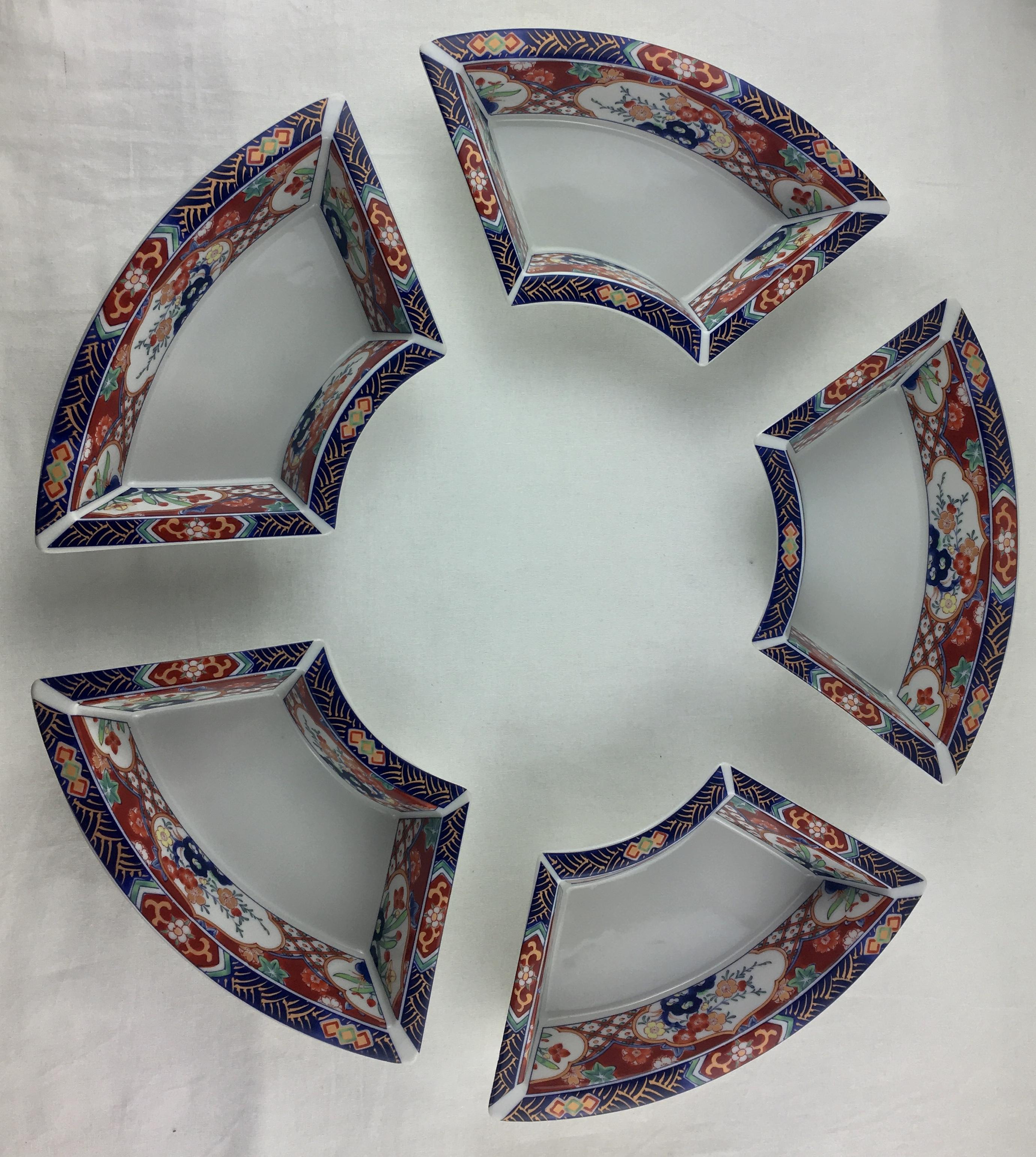 Imari hand painted service comprised of 5 dishes which can be used as an ensemble or separately, 20th century. 

These Japanese Imari porcelain dishes possibly for presenting cooked rice at a celebration, sauces, etc.. are. thickly painted and