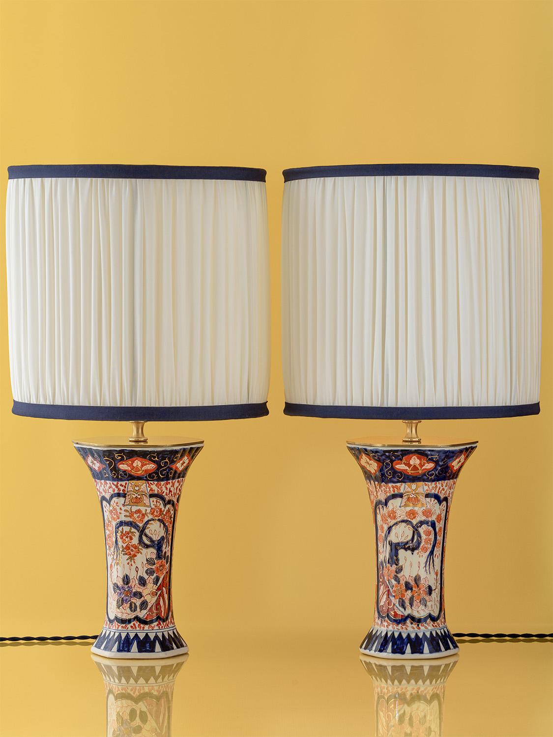 Meticulously handcrafted by Amitābha Studio in Amsterdam, this pair of one-of-a-kind table lamps is made from rare, hand-painted Imari-style vases by renowned Dutch ceramic artist Jaap Heinen. Created during the 1980s in Heinen’s Putten studio,