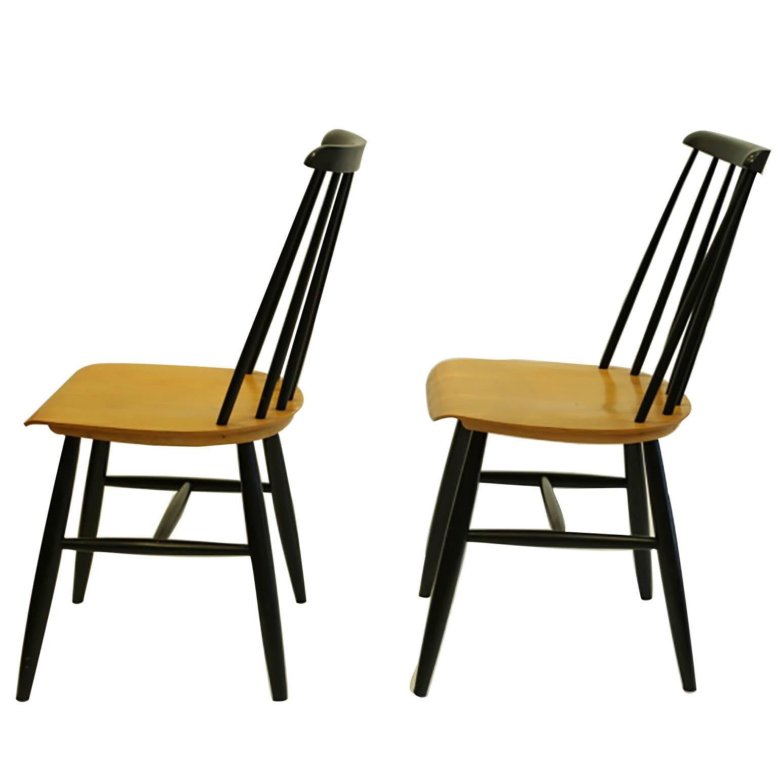 Price is per chair
May be sold separately 

Pair of teak and black lacquered dining chairs by Imari Tapiovaara. Made in Sweden.