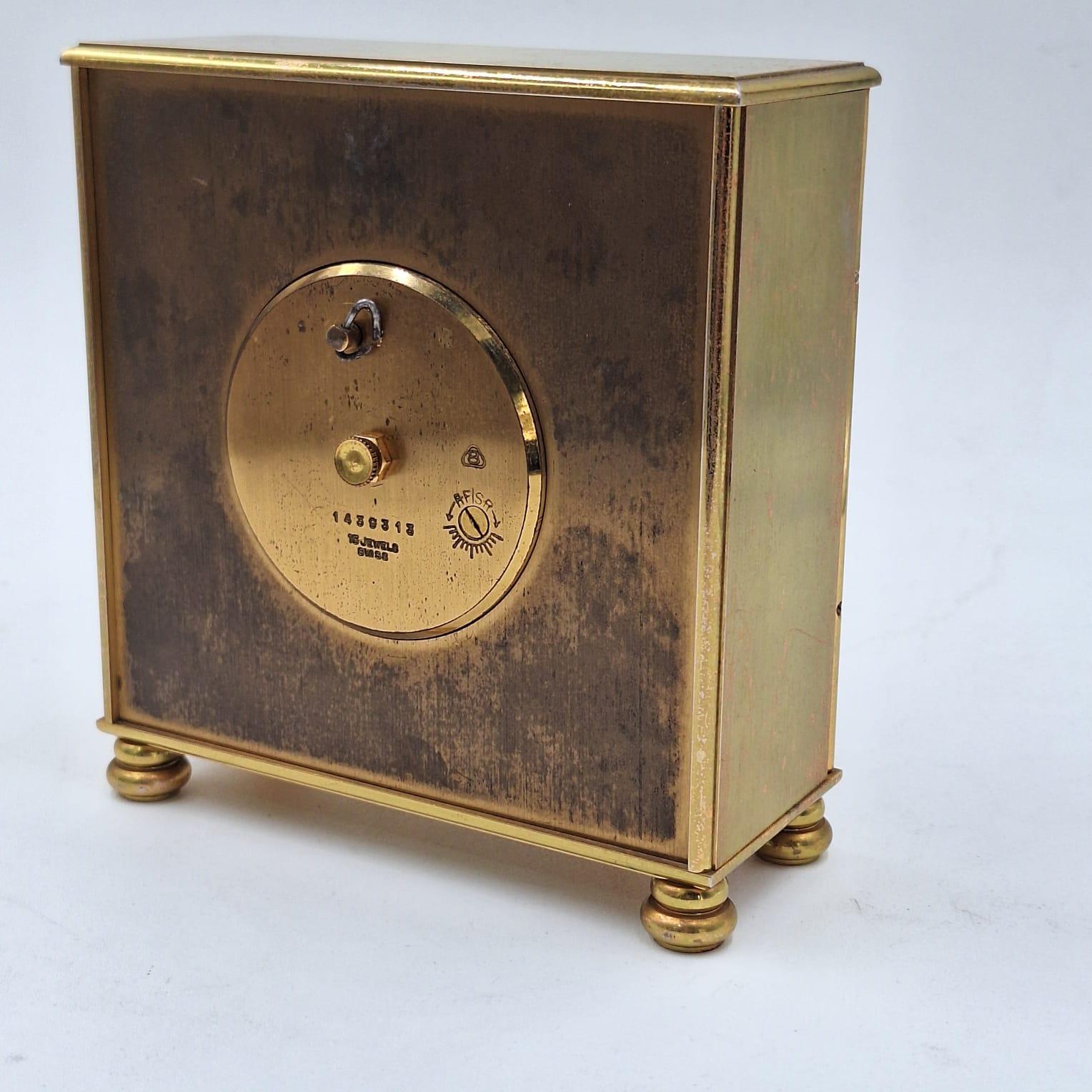 Imhof mid-century table clock
Enamel painted dial (represents a galleon)
Manual winding (8 days of winding)
15 jewels
Works properly
Case number 12329
Circa 1960 Origin Switzerland
Mid-century style
The clock has 4 legs on which it rests and has 2