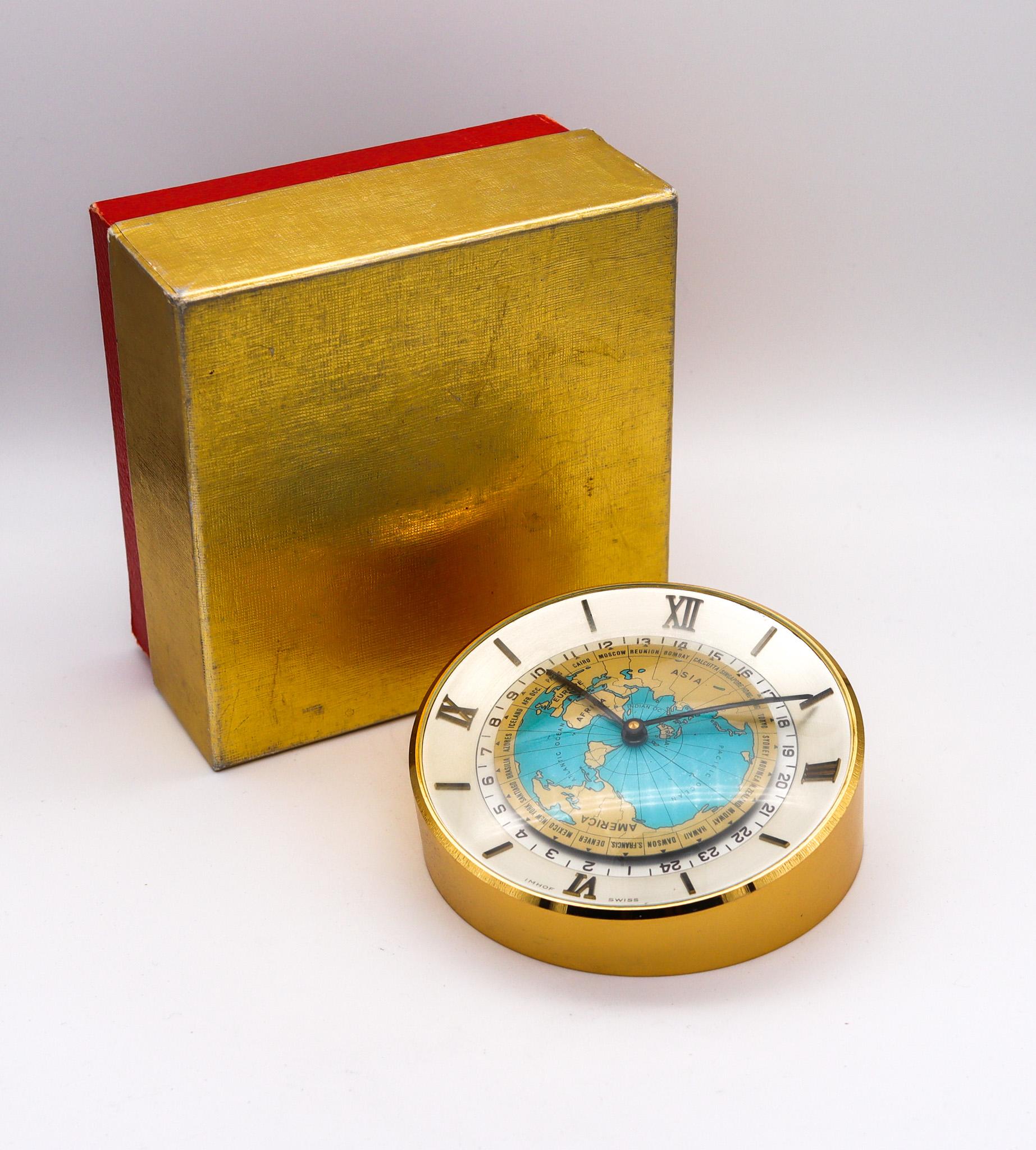 Desk world timer clock designed by Arthur Imhof.

Fabulous and highly attractive desk-table clock, created in Switzerland by the clocks makers house of Imhof, back in the 1960. This world timer clock is rare to see in this pristine condition. Has