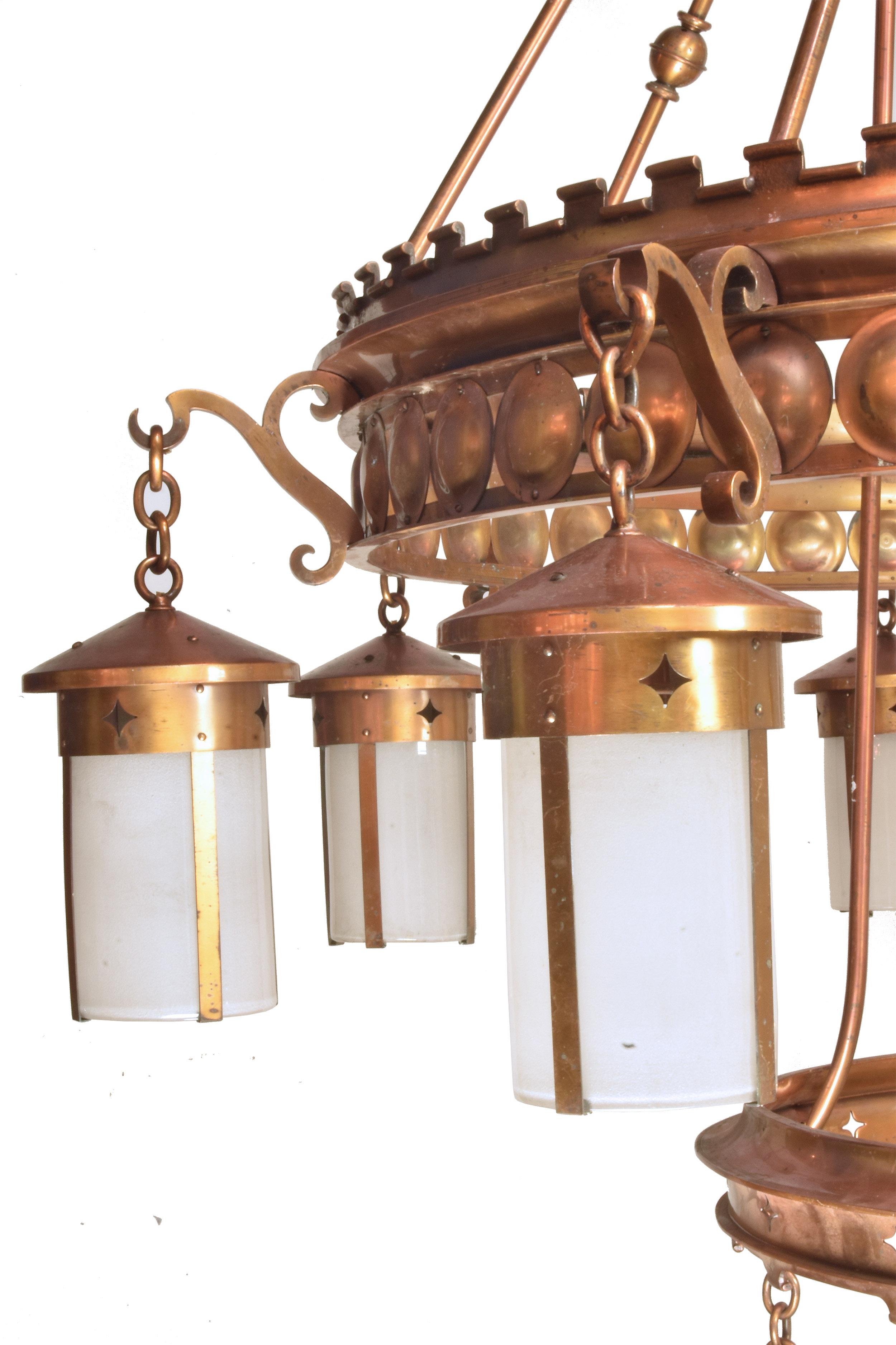 Twelve 7'‘ by 12” Lanterns on this oversized Arts & Crafts (1910) chandelier will provide beautiful illumination for any large space. The fixture has a beautiful, rich patina. A matching pair make these even more of an statement of pure Arts &