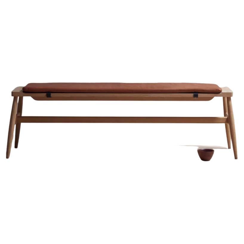 The Imo bench : rigorous simplicity & comfort

The solid timber Imo bench has a sculpted top to accommodate an upholstered pad held in place with leather straps. The pad is available in our house leathers in black or tan.

This contemporary and