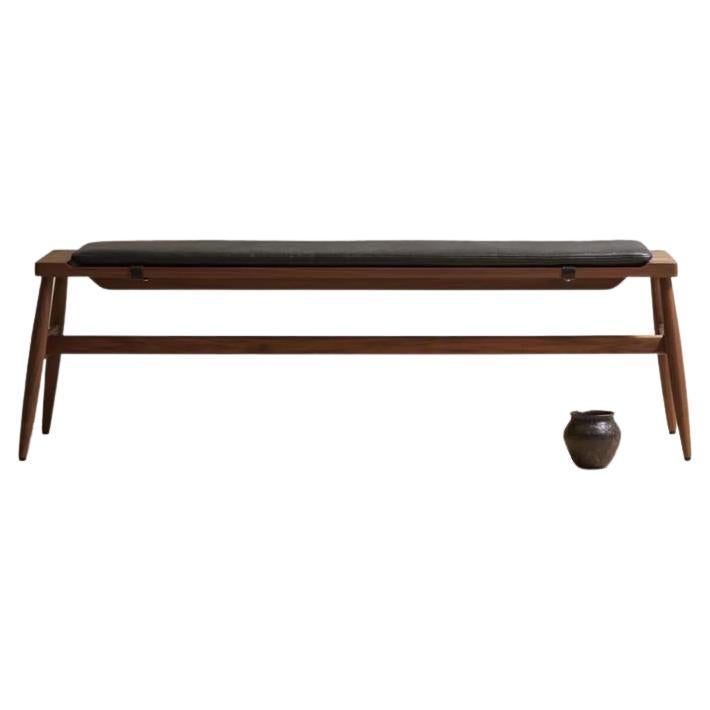 The Imo bench : rigorous simplicity & comfort

The solid timber Imo bench has a sculpted top to accommodate an upholstered pad held in place with leather straps. The pad is available in our house leathers in black or tan.

This contemporary and
