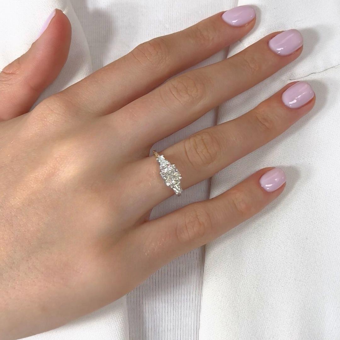 Impeccable 2.16ct Diamonds 3-Stone Ring in 18k Yellow & White Gold - IGI Certified

This 18k yellow and white gold ring is a stunning blend of design and timeless elegance. It features a captivating 1.50ct cushion-cut diamond. Flanked by two