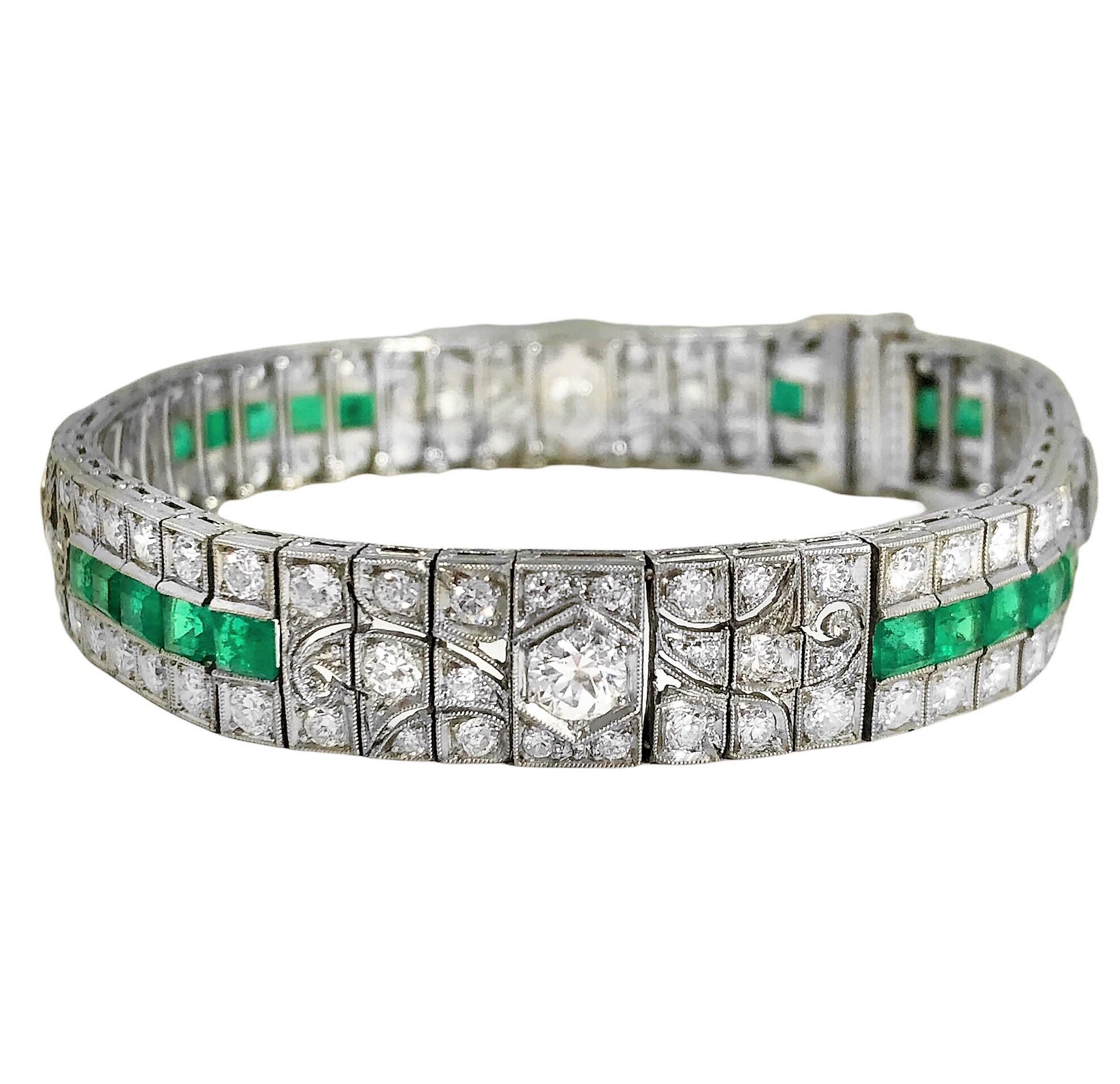 This impeccable Art Deco period bracelet is set with Old European cut diamonds and with a vivid strip of fine emeralds. The diamonds weigh an estimated total 8.50ct of overall G/H color and VS2 clarity, and the assorted emeralds weigh an approximate