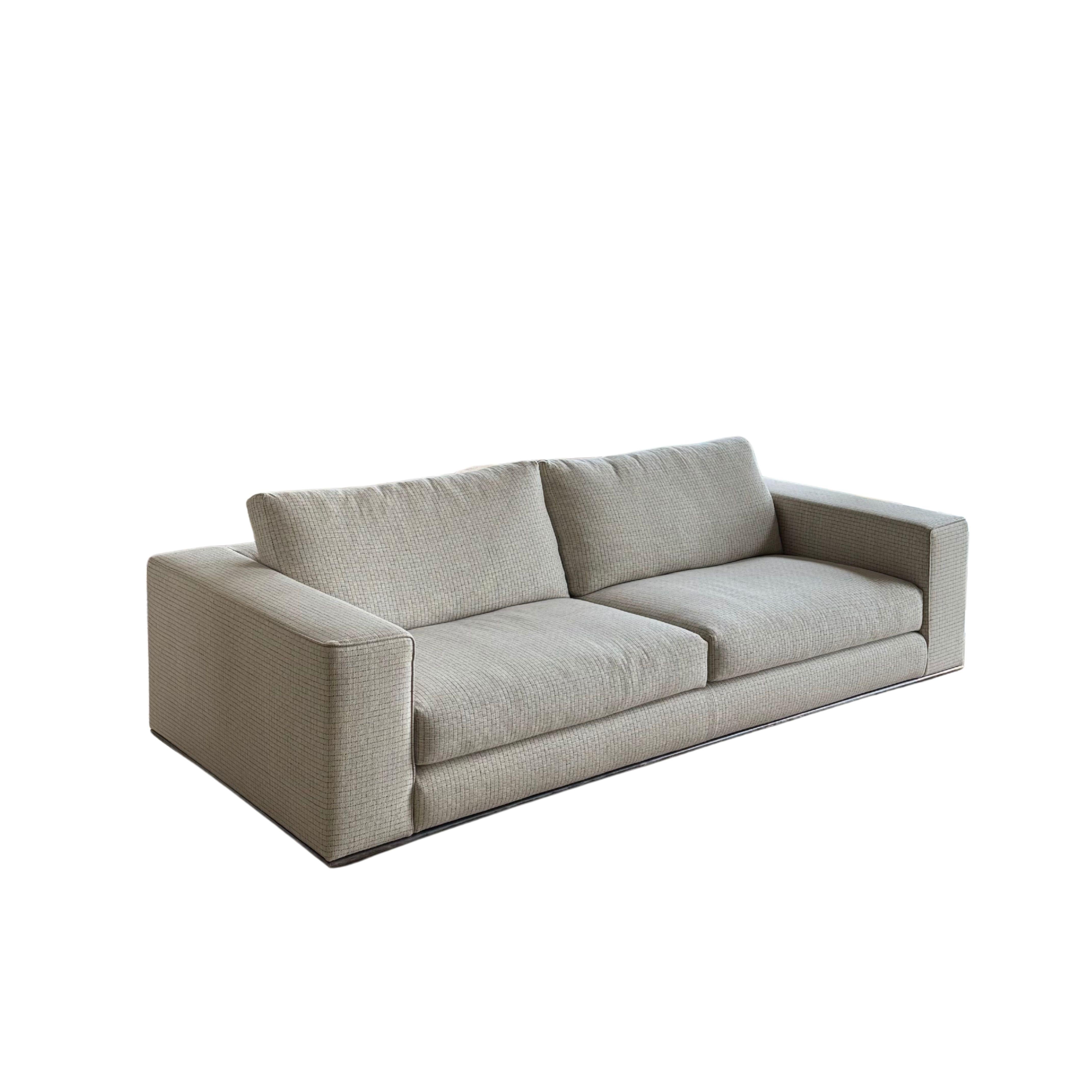 A masterclass in modern elegance, this custom Hamilton sofa exemplifies Minotti's commitment to refined craftsmanship and understated sophistication.
With sculptural lines, luxurious woven wool upholstery (see close-up picture of the fabric), and